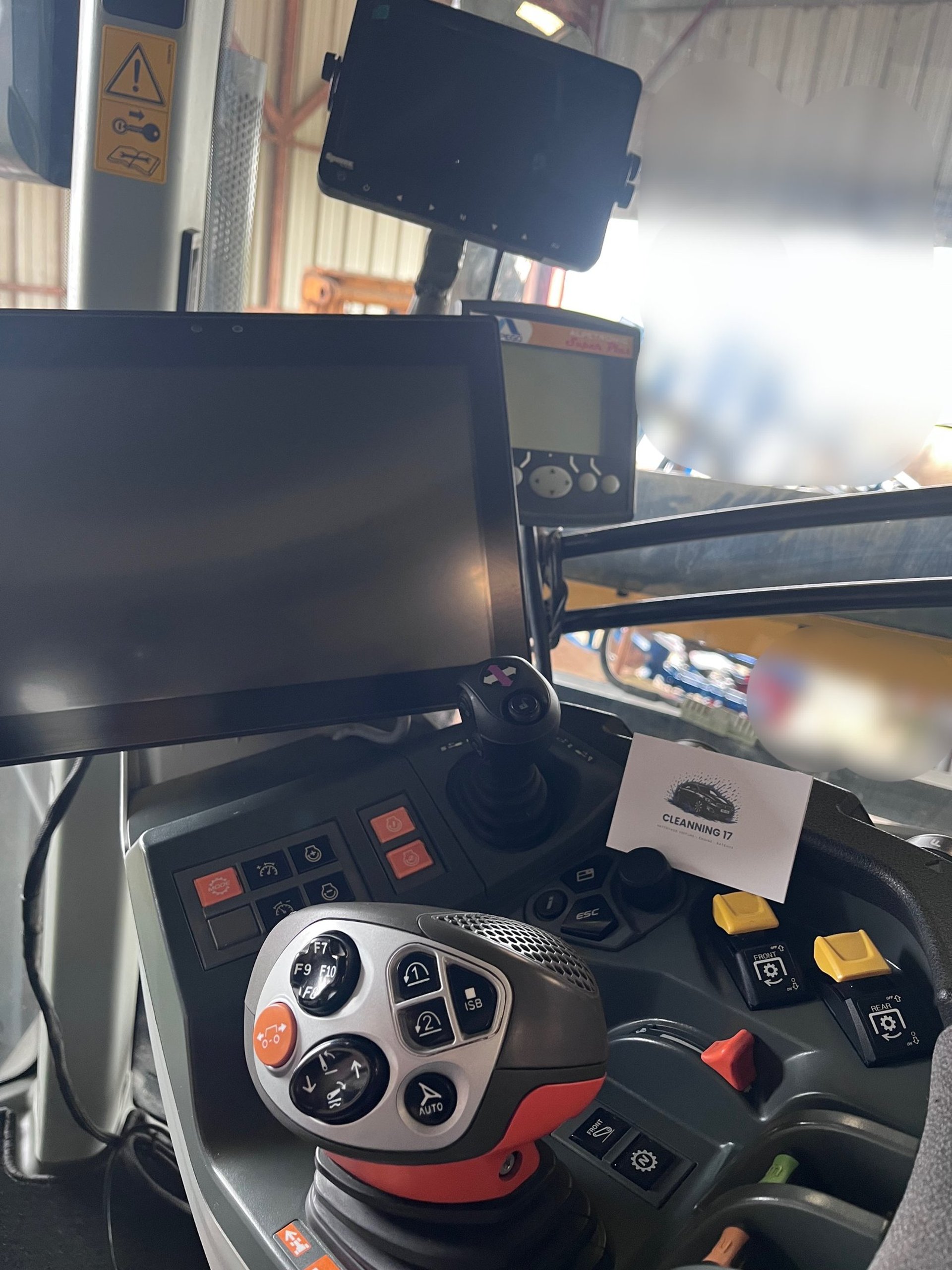 a silver car parked in a garage with a checkered floor