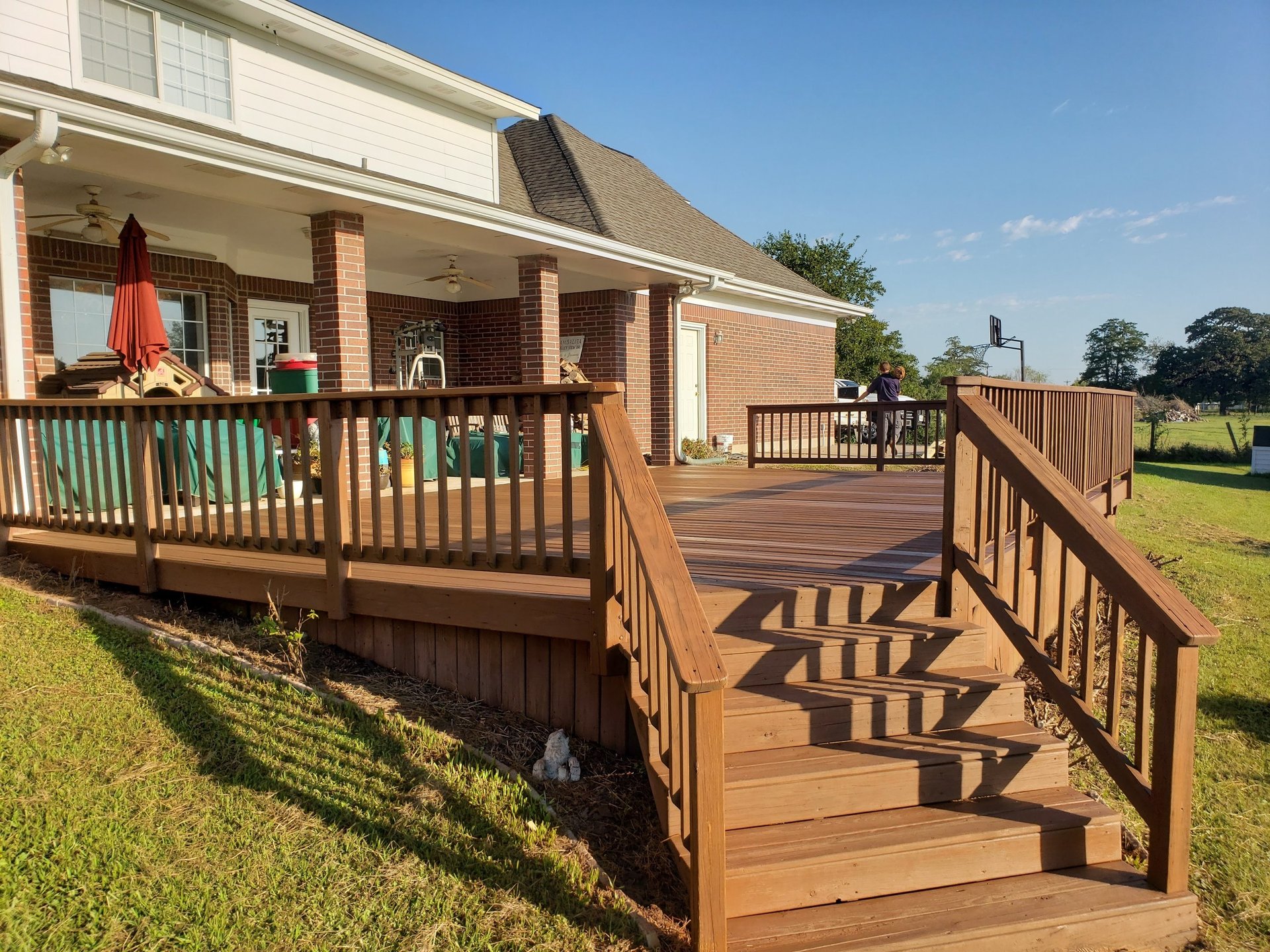 woman wearing yellow long-sleeved dress under white clouds and blue sky during daytime