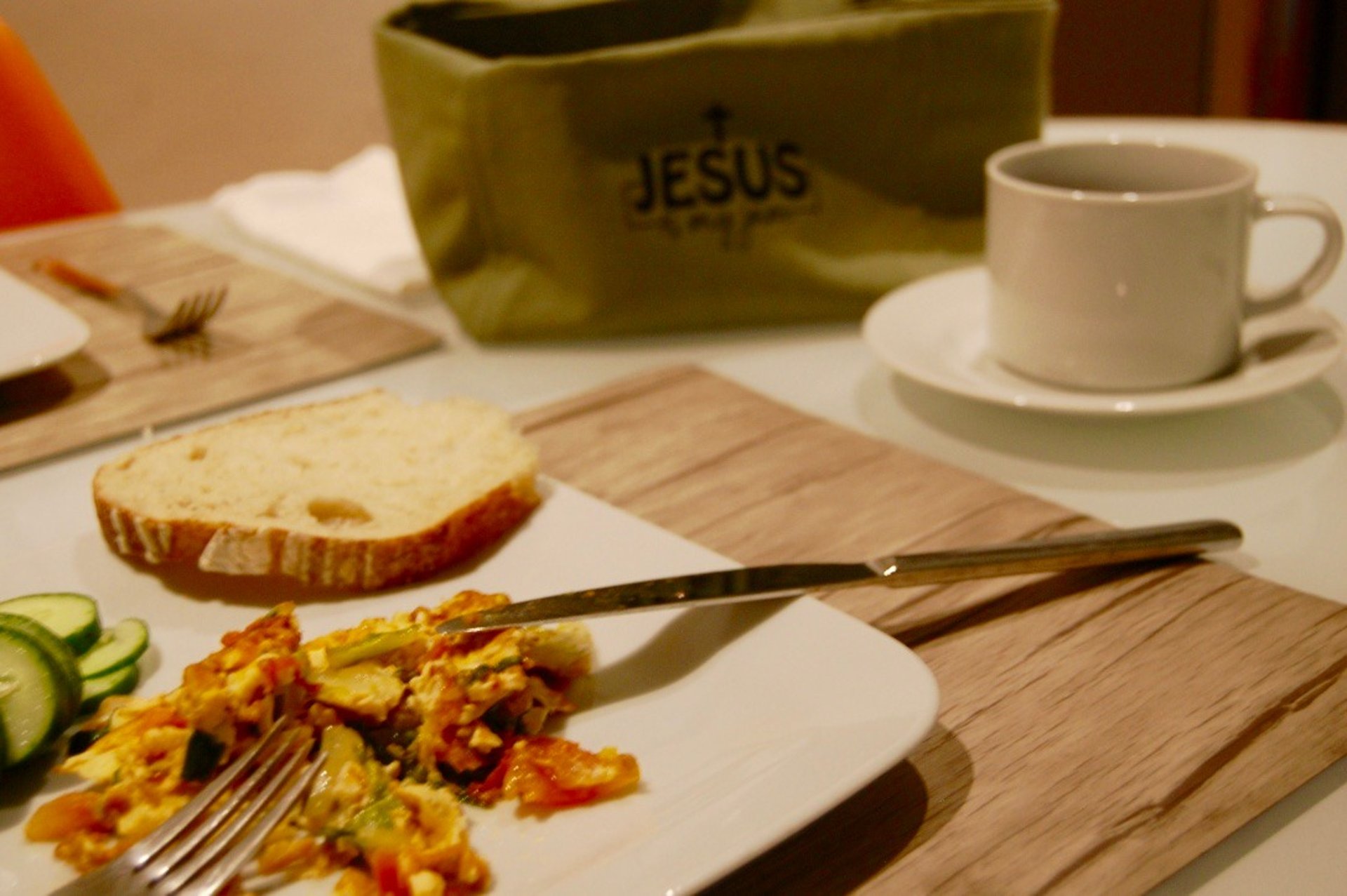 Slice of berry pie with whipped cream and coffee.