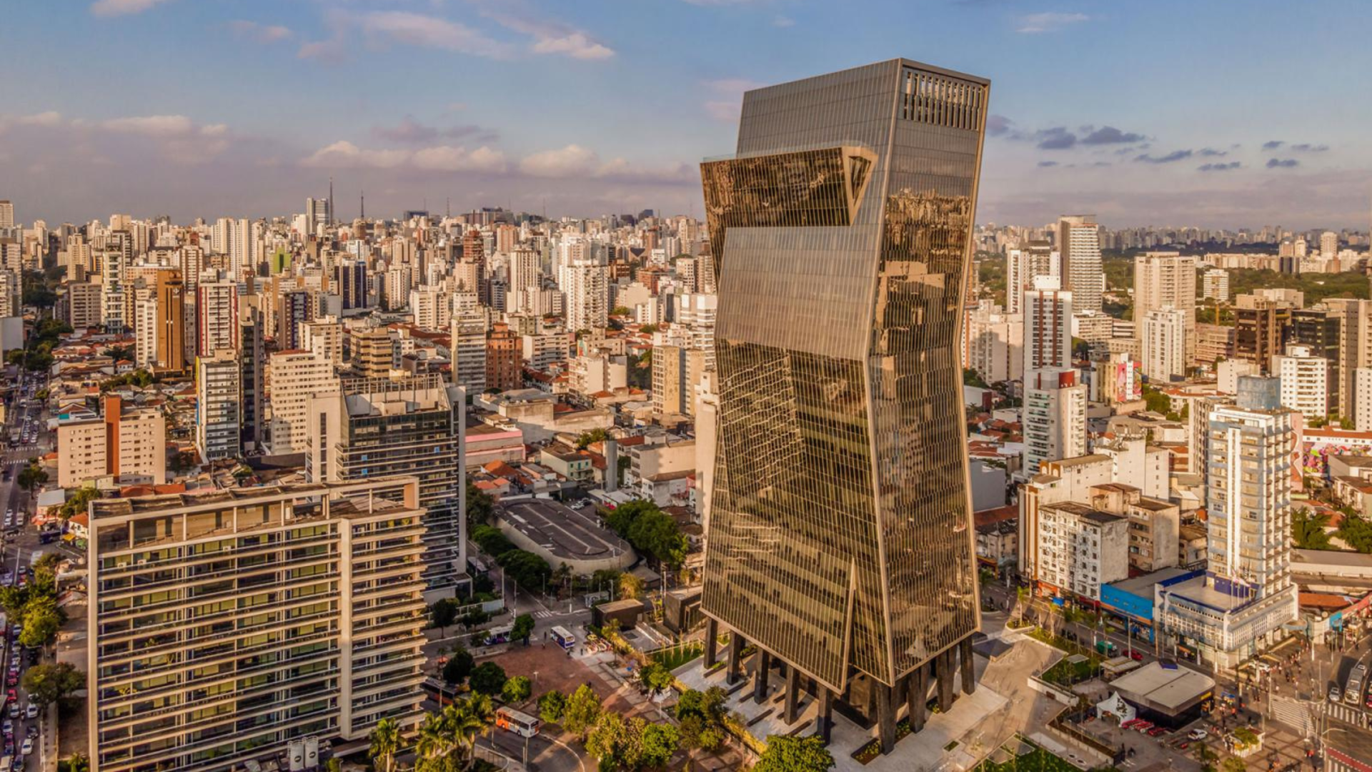 A building with columns and a clock on the top of it