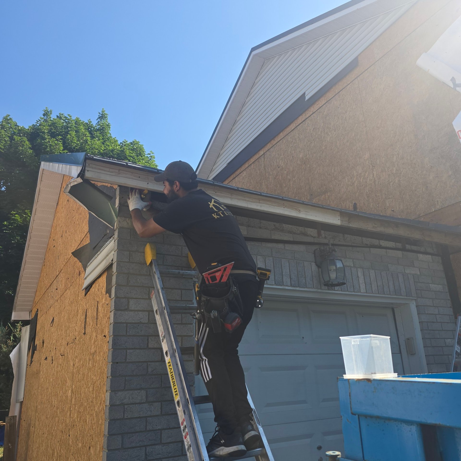 man in red long sleeve shirt holding black and yellow corded headphones