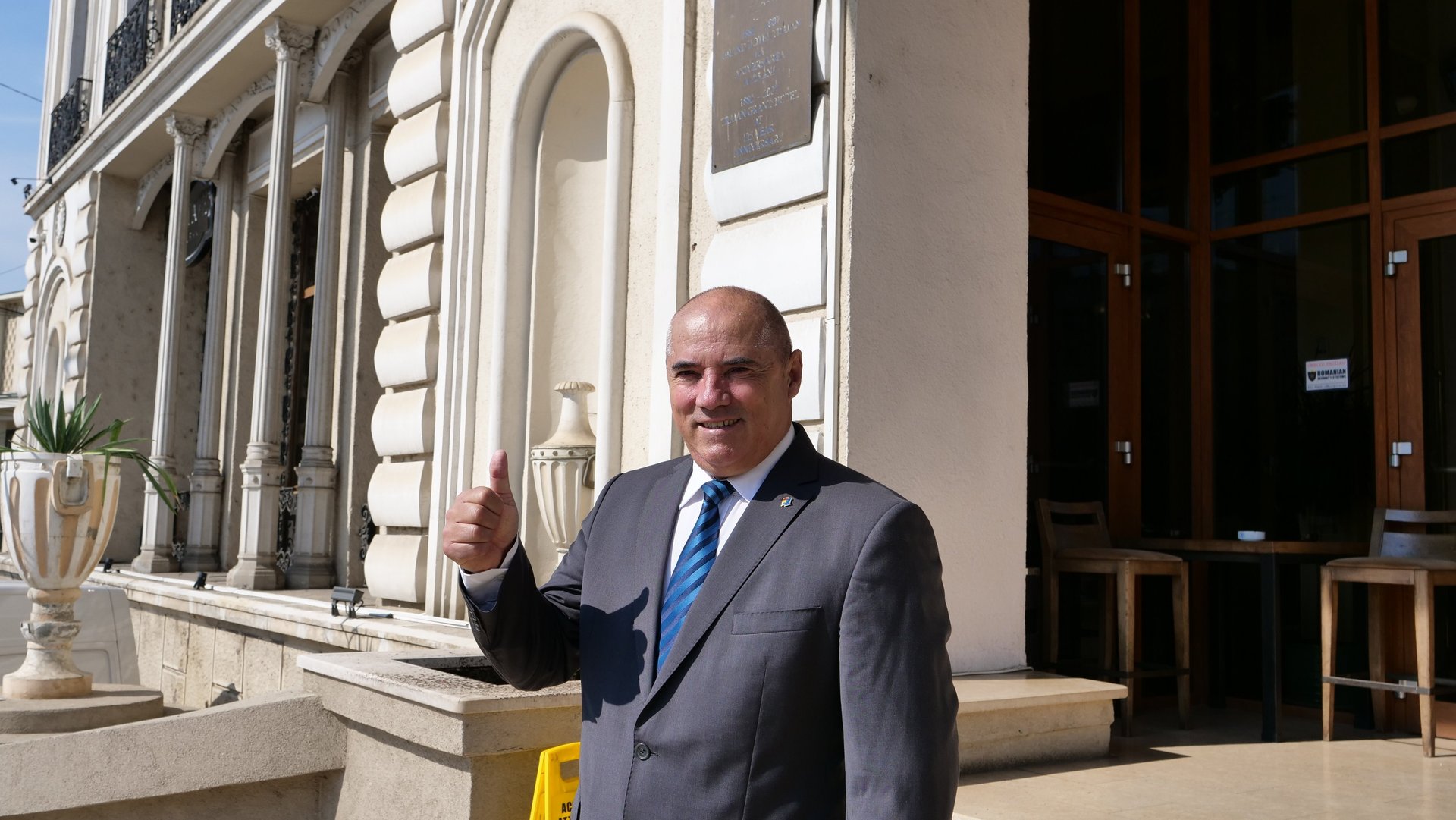 woman wearing yellow long-sleeved dress under white clouds and blue sky during daytime