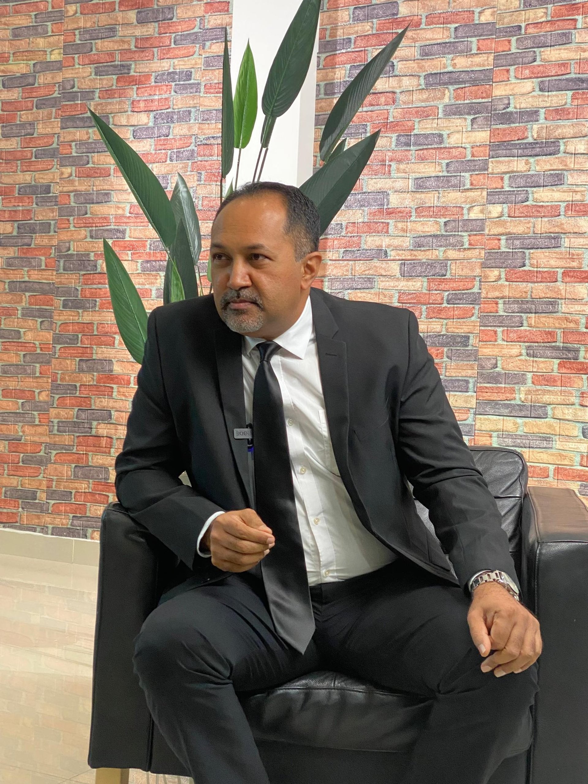 an abstract photo of a curved building with a blue sky in the background