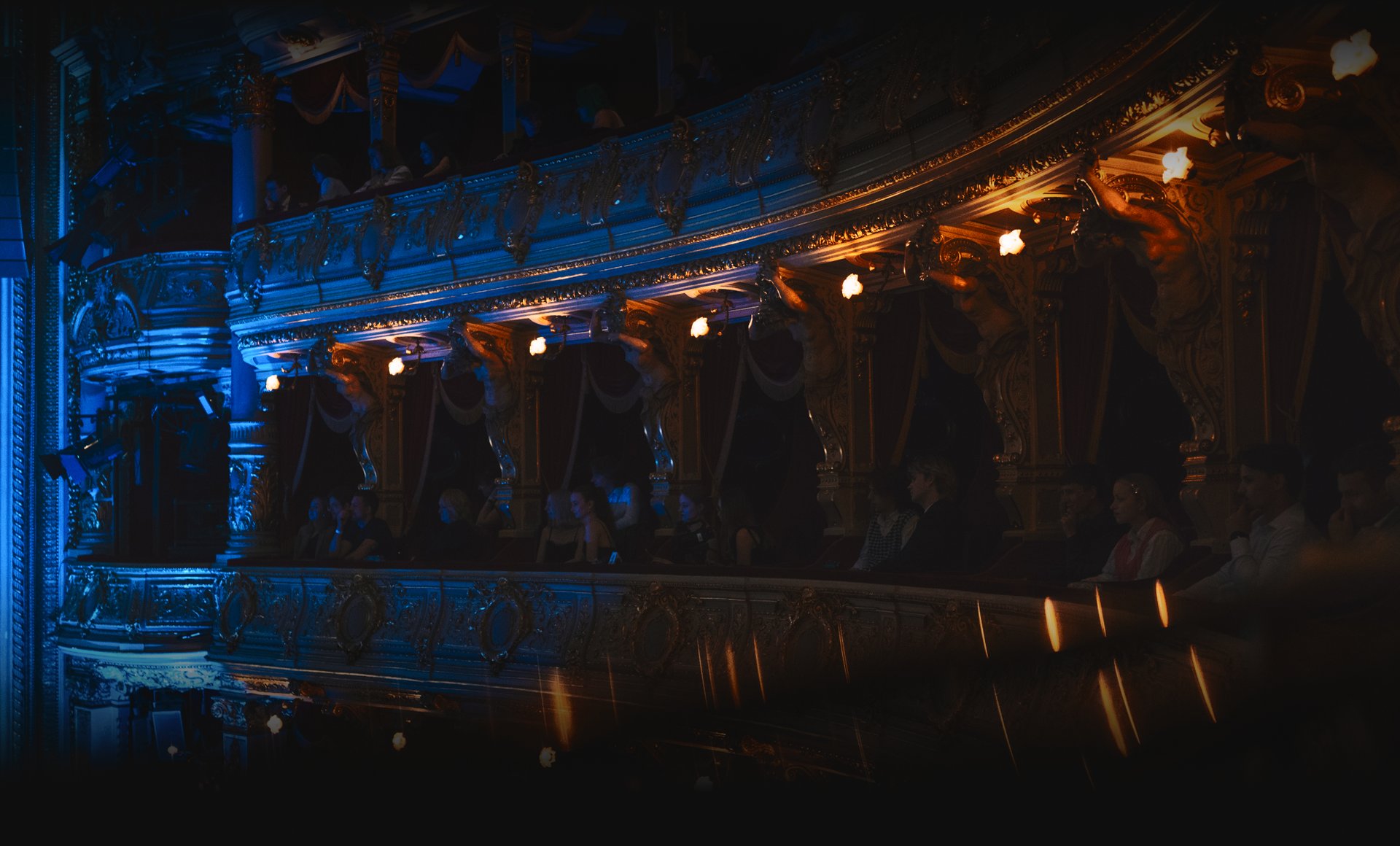 an abstract photo of a curved building with a blue sky in the background