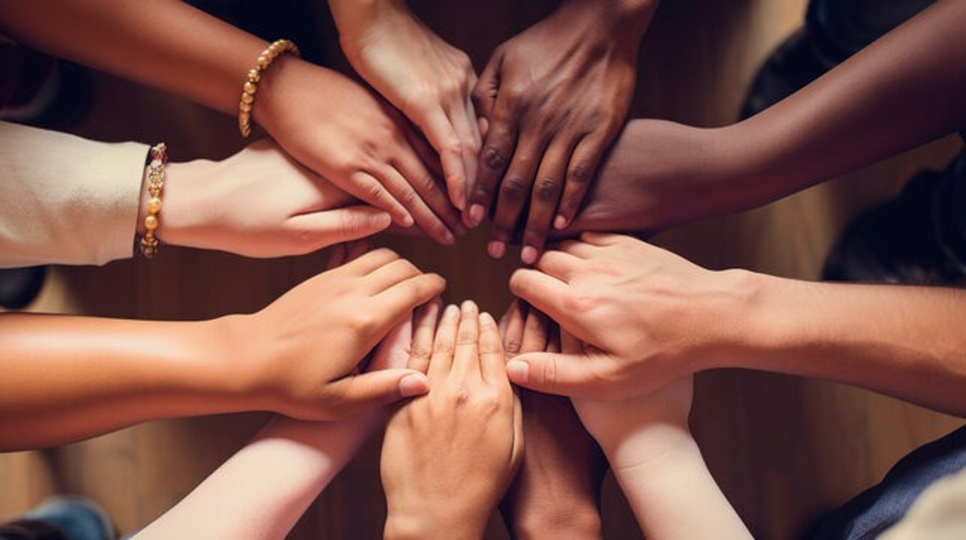 person raising his right hand under blue sky and white clouds during daytime