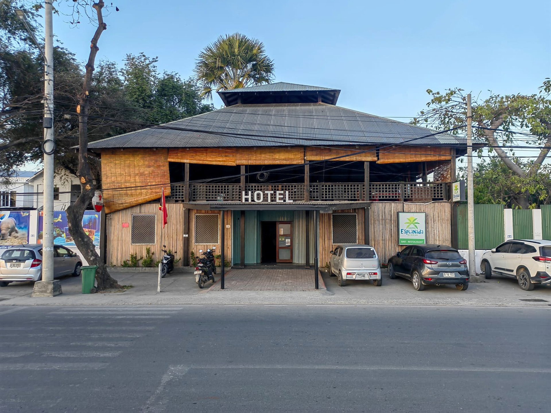 an abstract photo of a curved building with a blue sky in the background