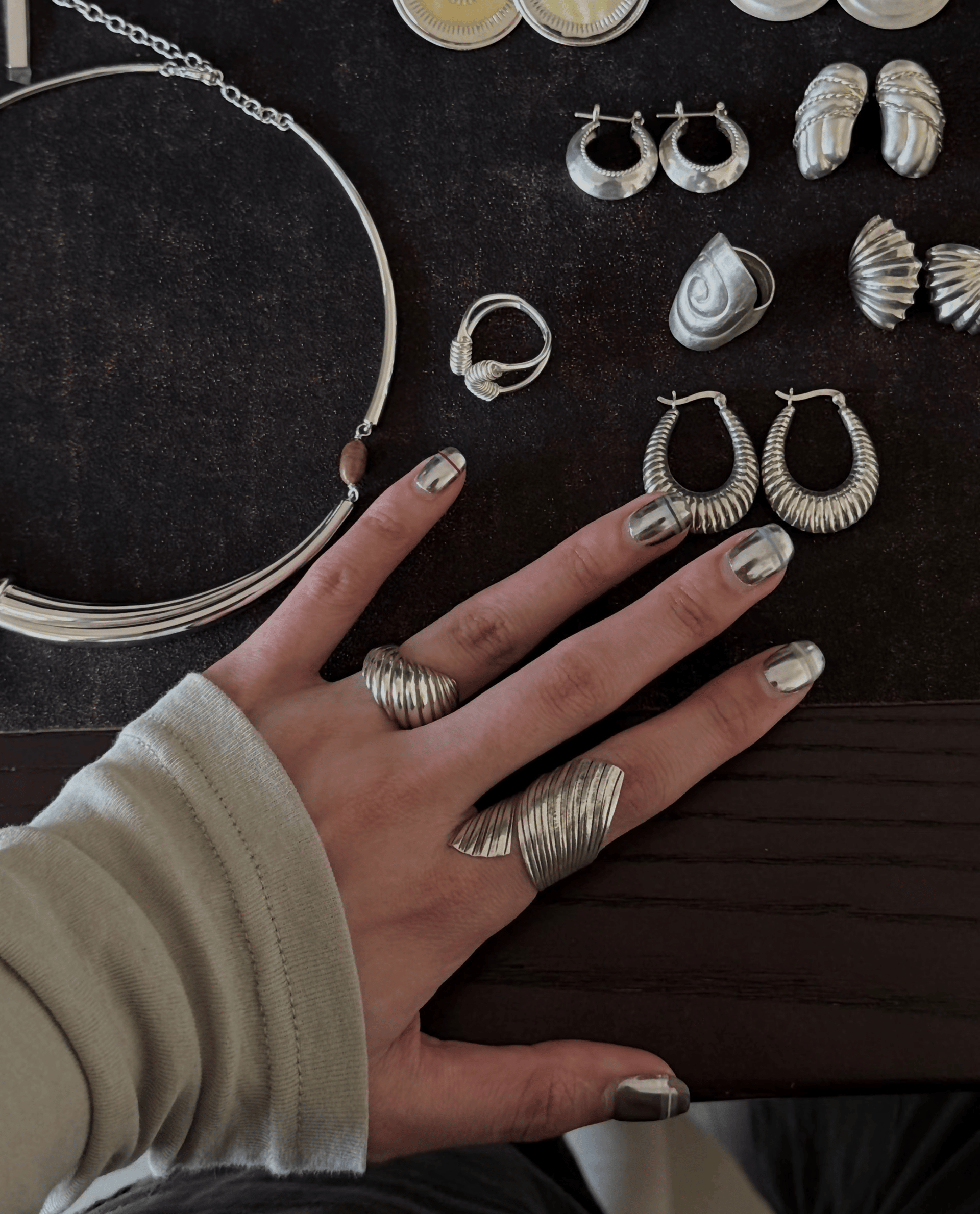 A pile of gold nuggets sitting on top of a wooden table