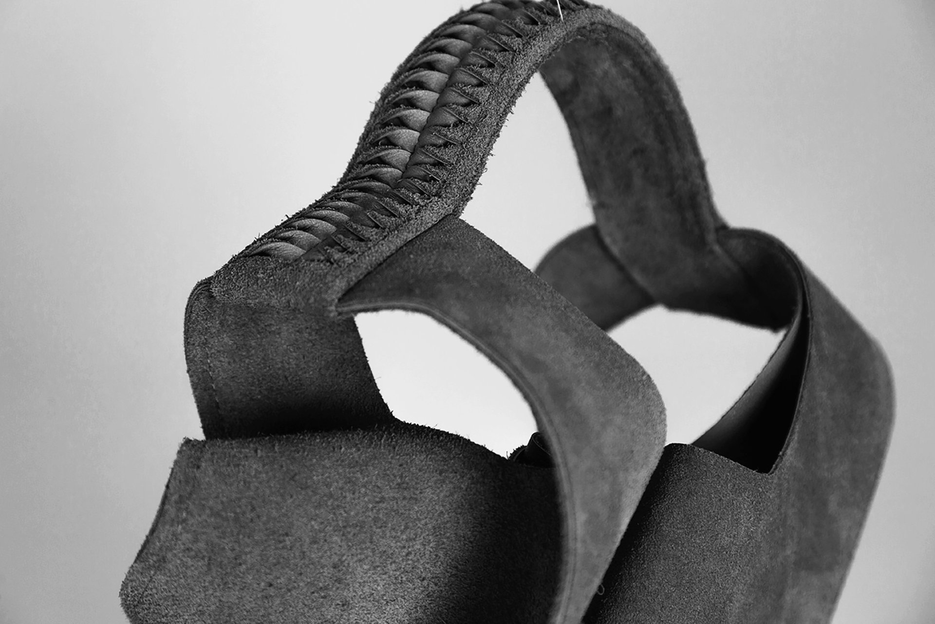 a close up of a black and brown abstract painting