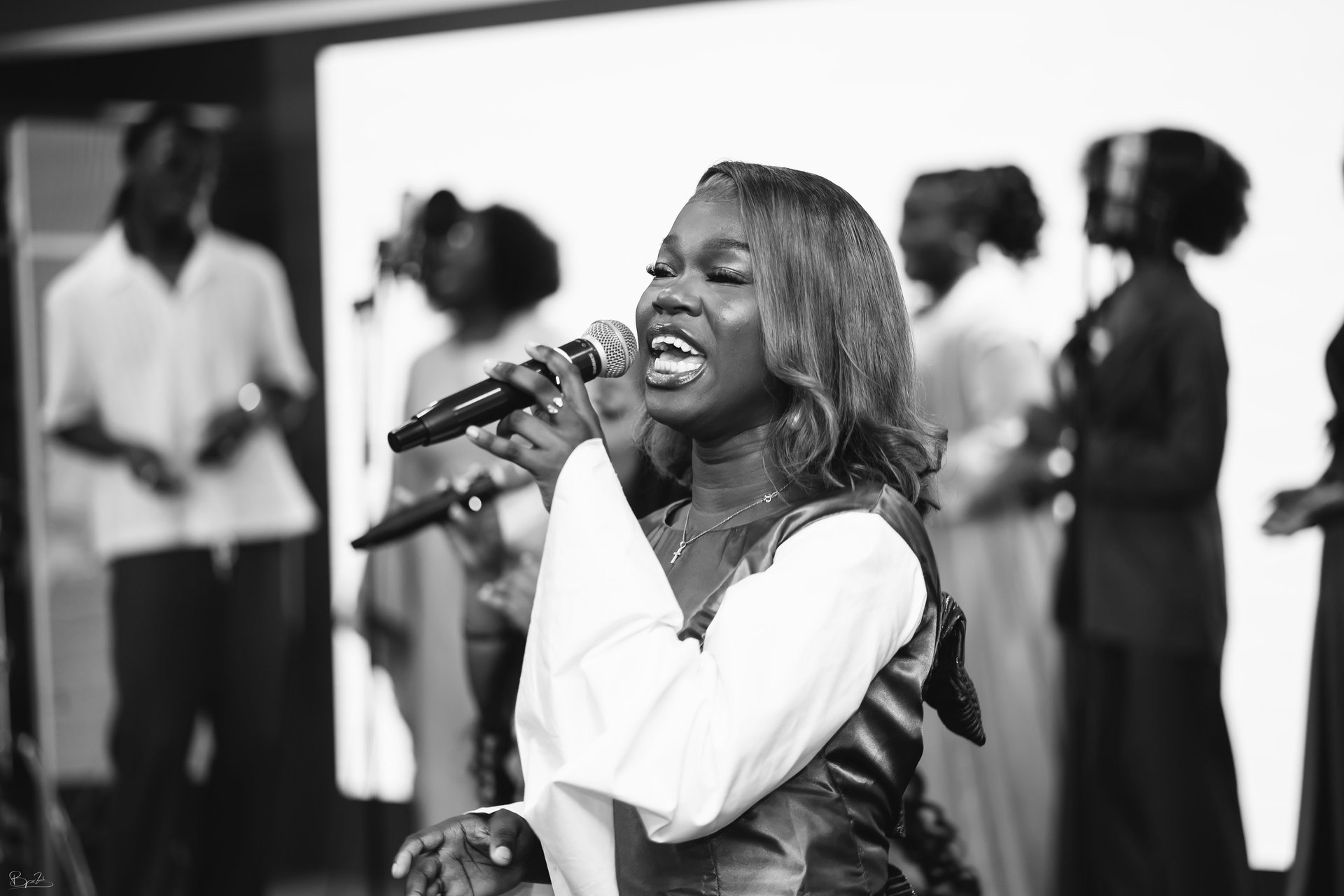 a close up of a black and brown abstract painting