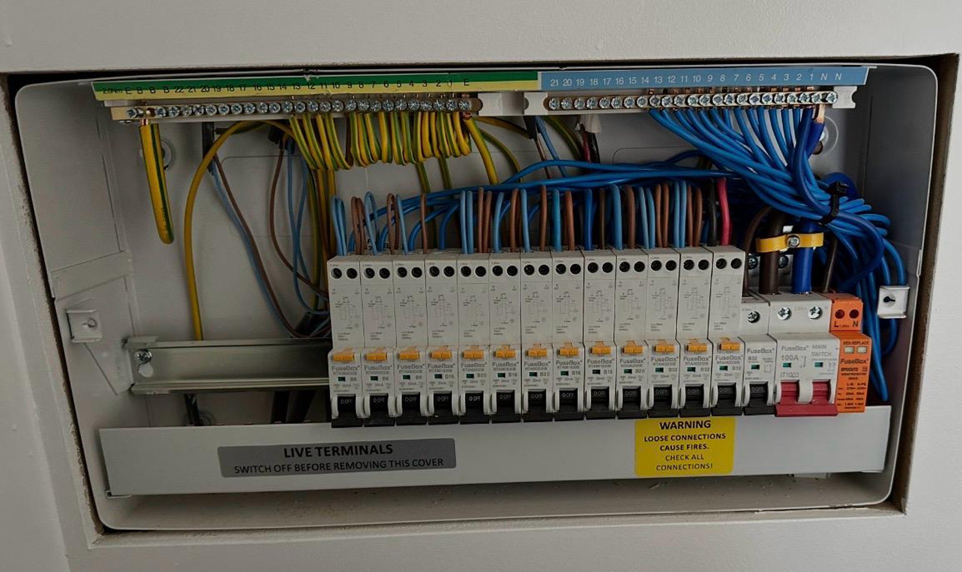 an abstract photo of a curved building with a blue sky in the background