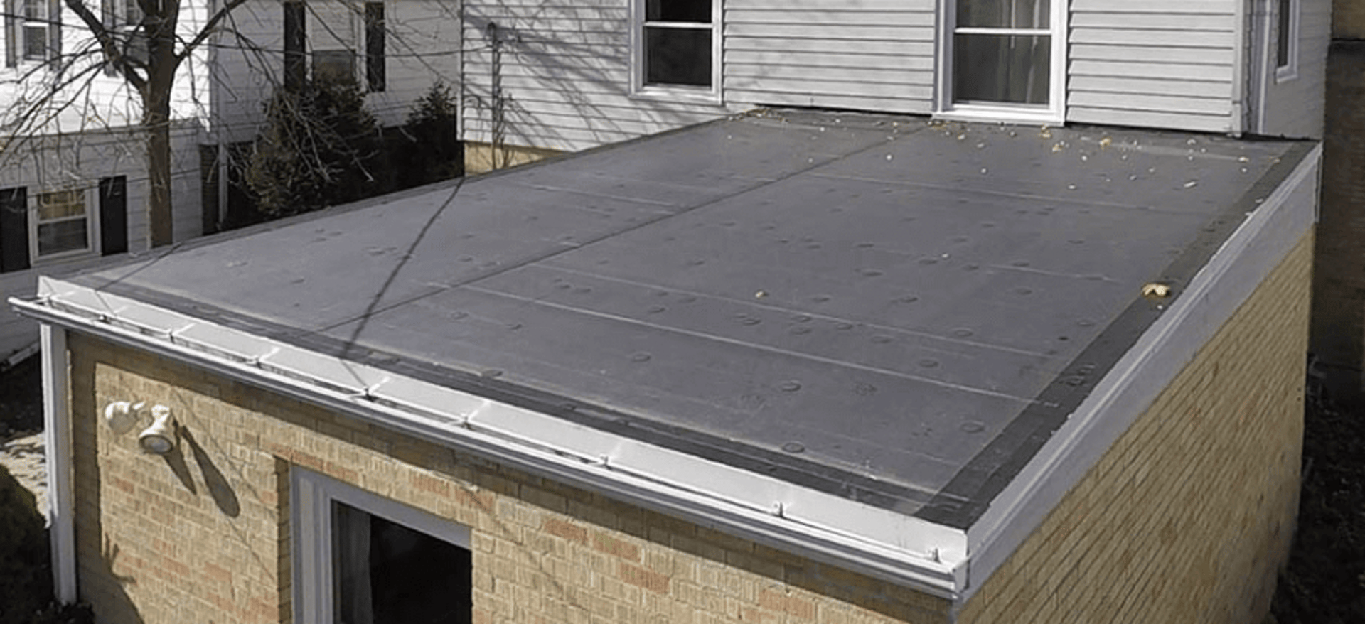 a man on a roof working with a rope