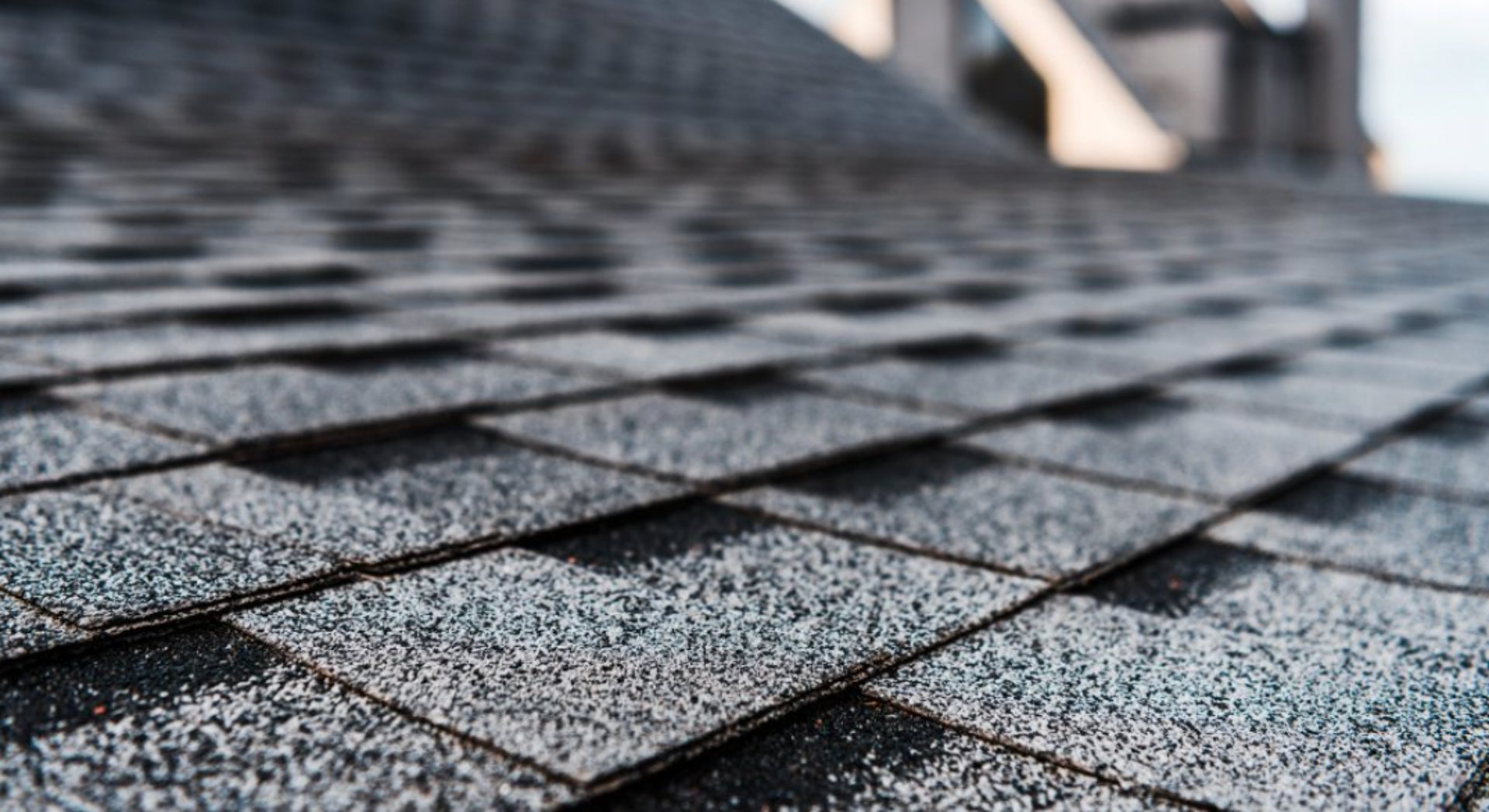 a man on a roof working with a rope