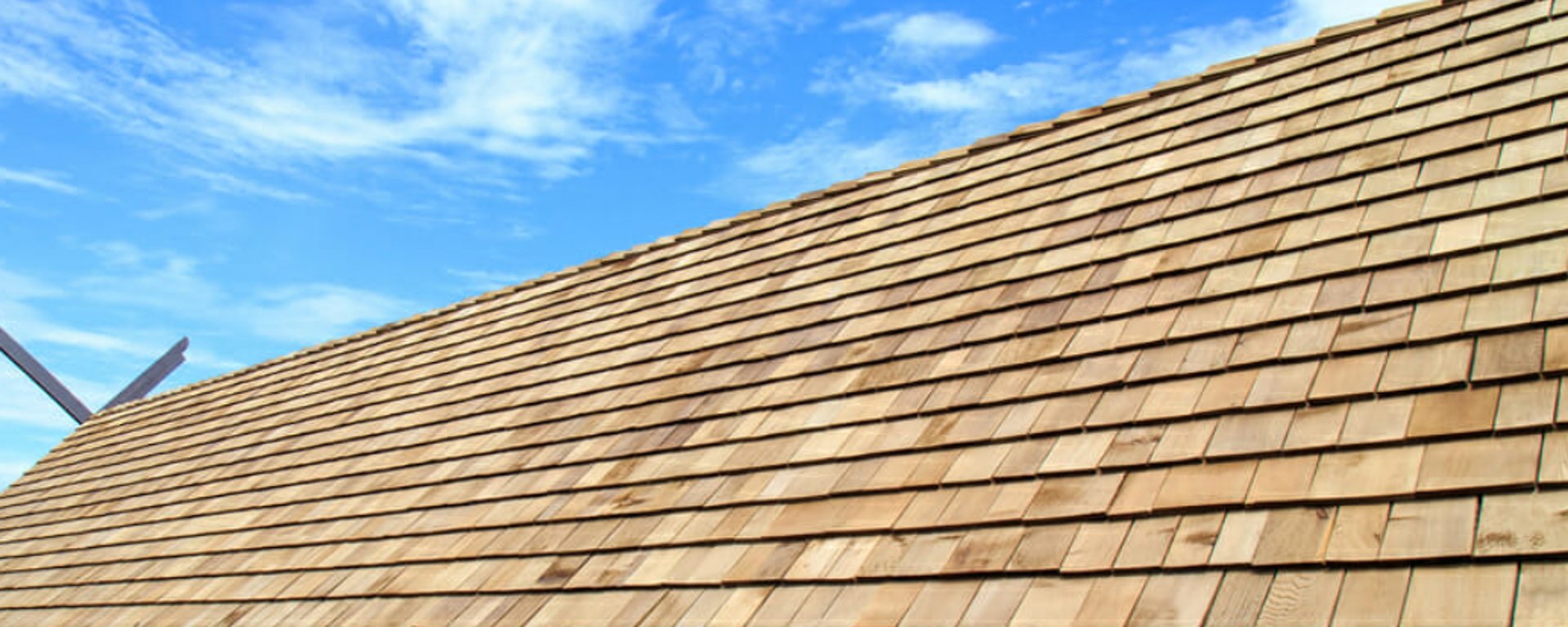 a man on a roof working with a rope