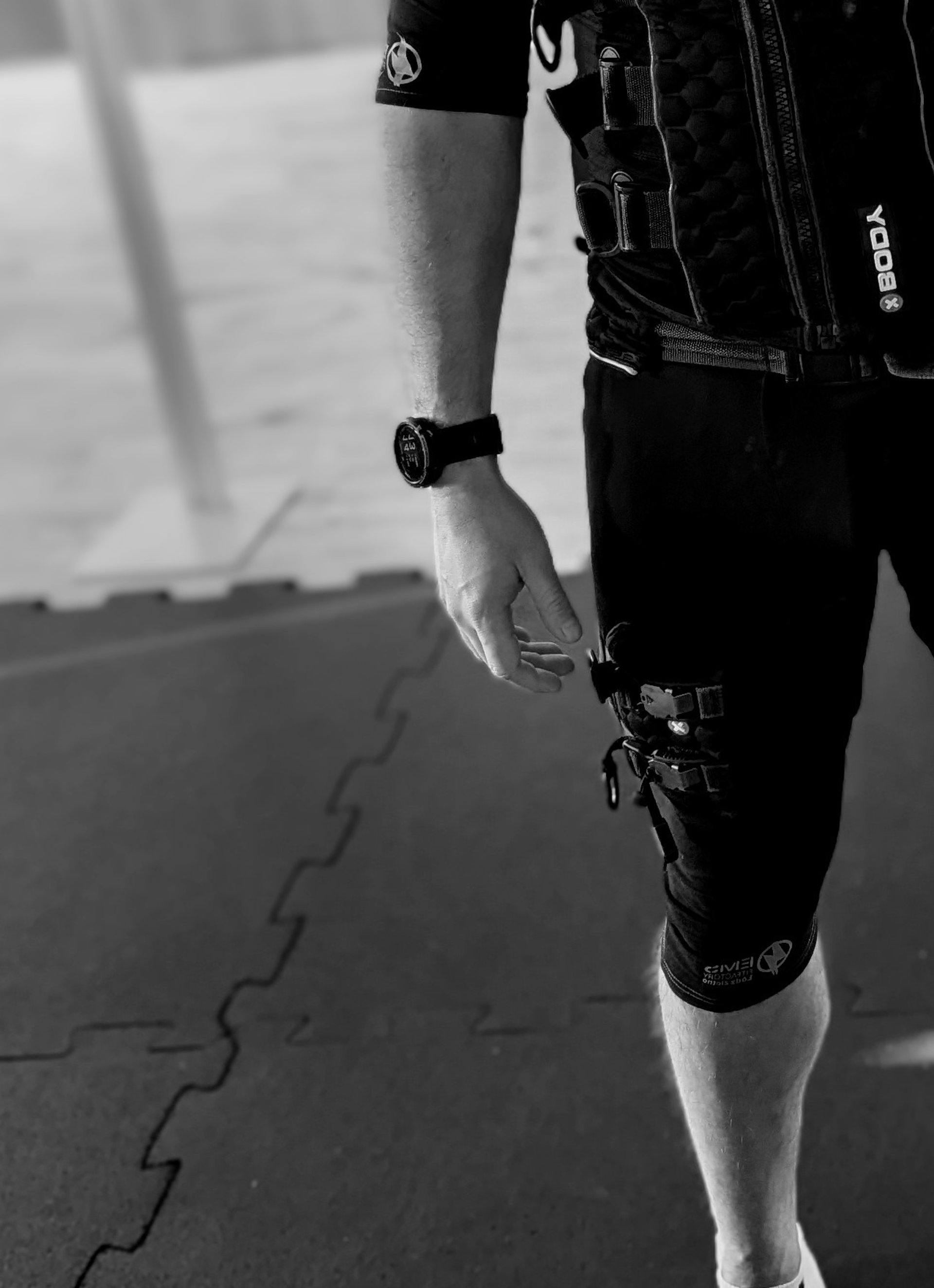 A black fire hydrant sitting on top of a sidewalk