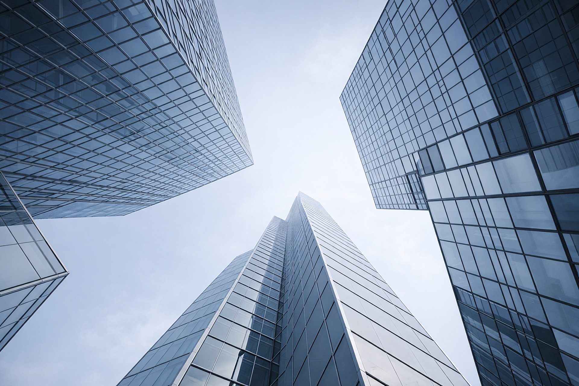 two people shaking hands over a piece of paper