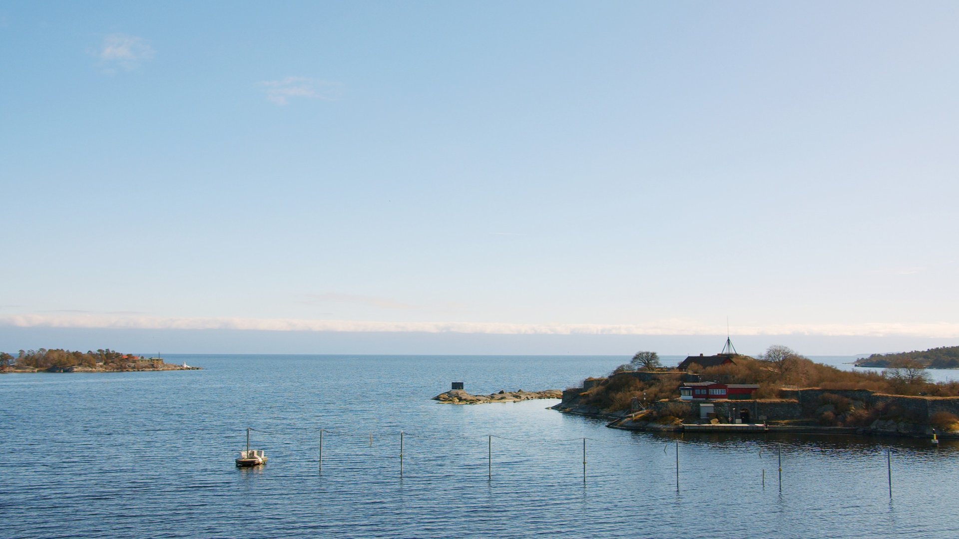 an abstract photo of a curved building with a blue sky in the background