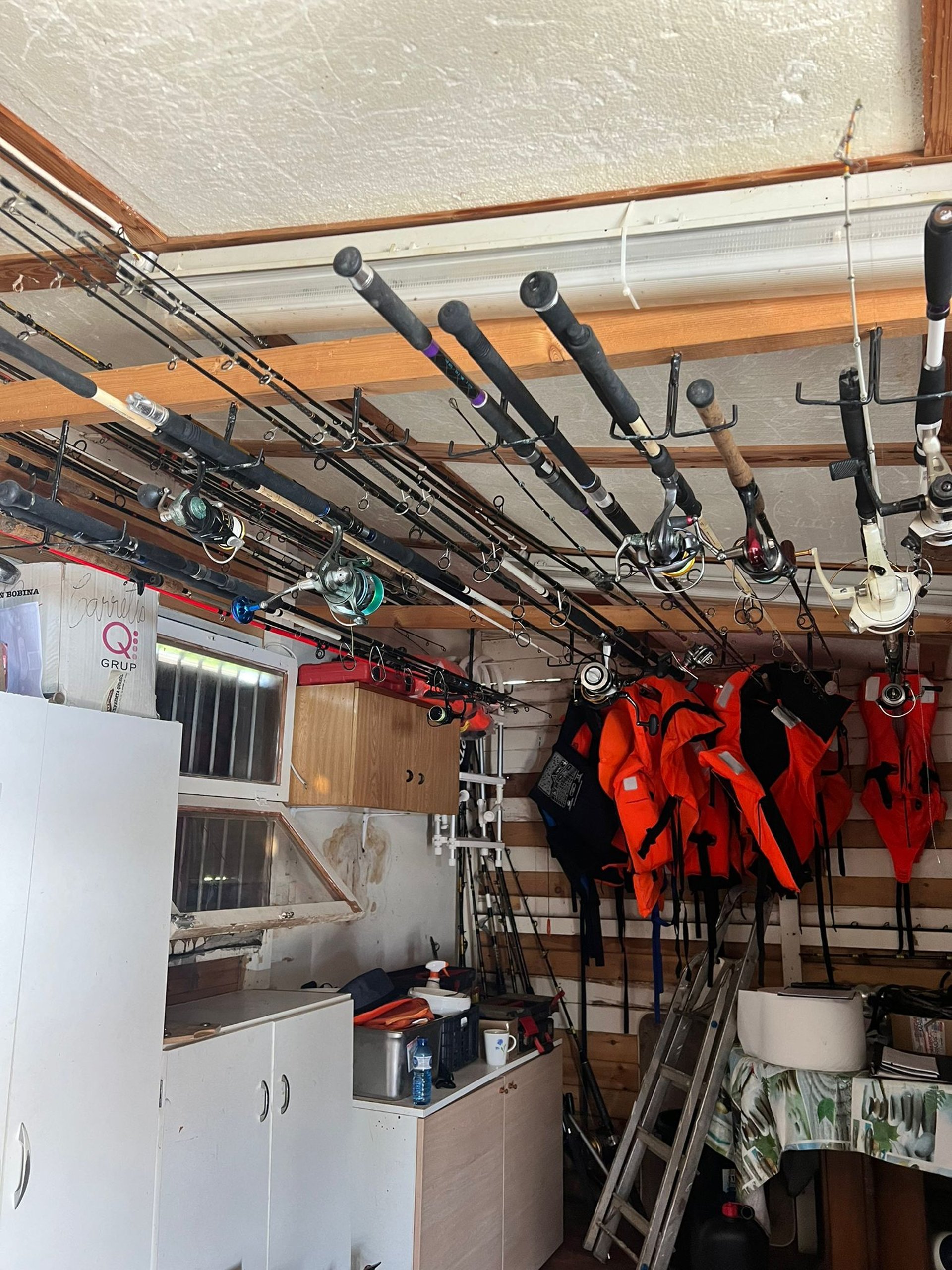 black and silver fishing rod on blue ocean water during daytime