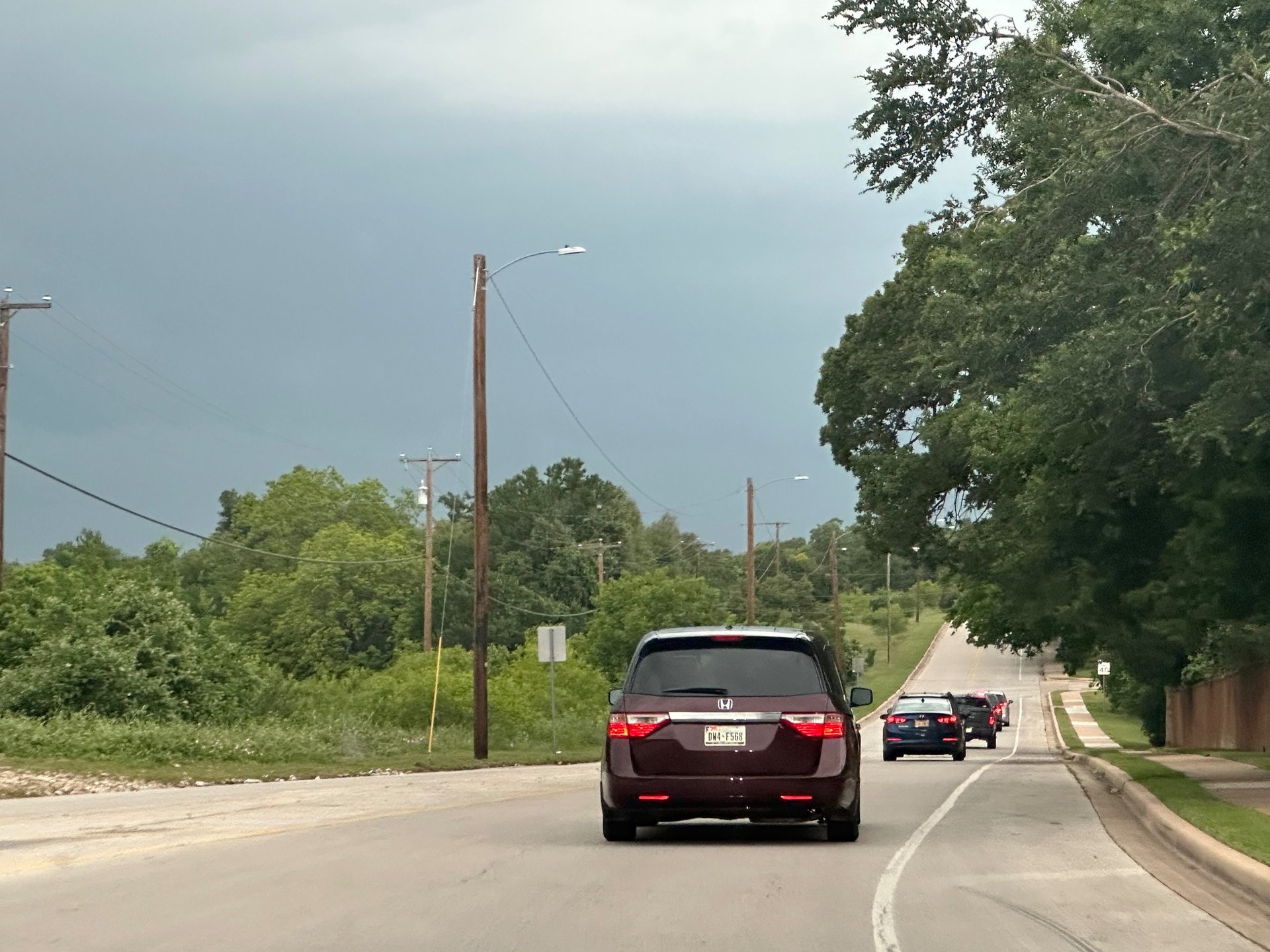 an abstract photo of a curved building with a blue sky in the background