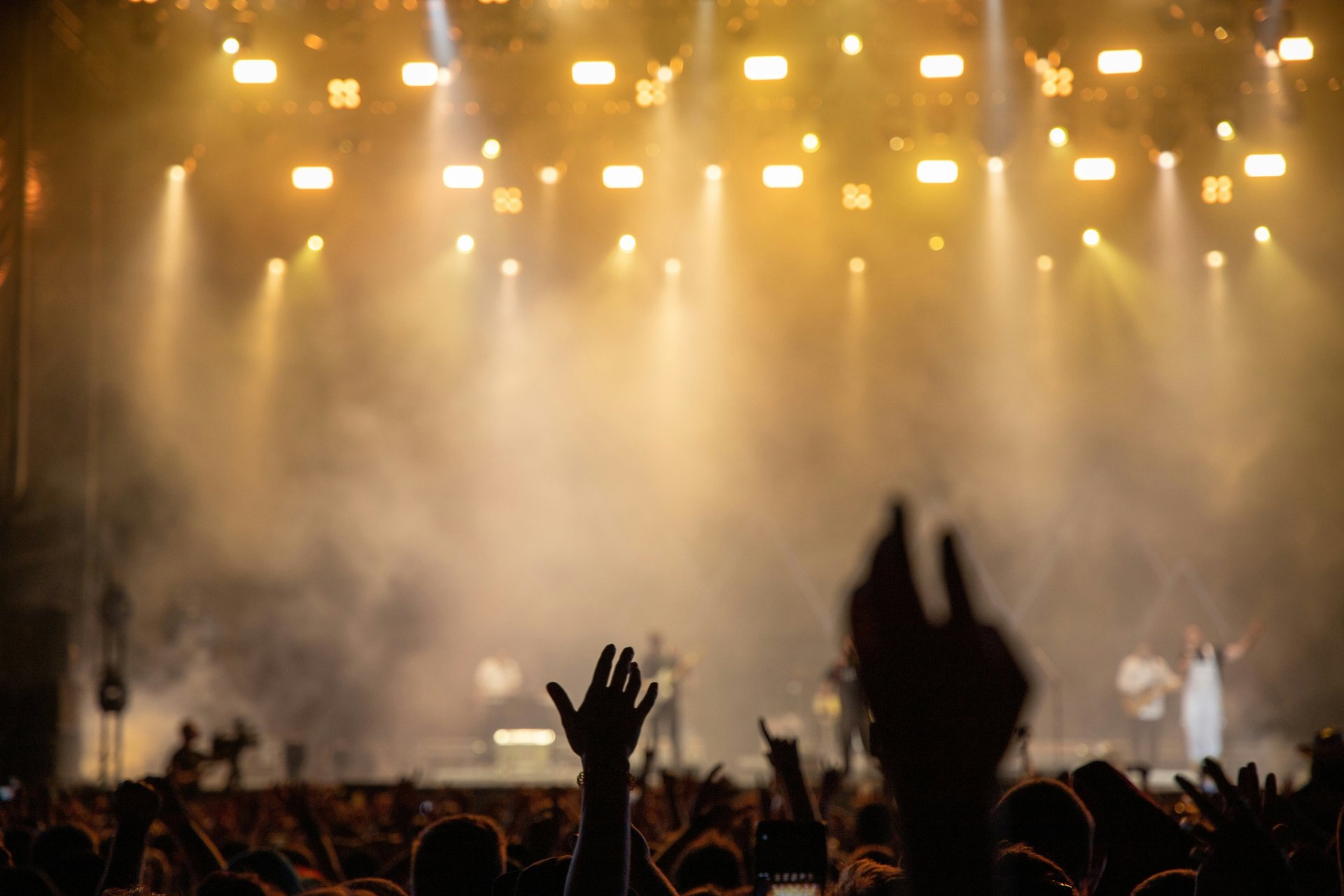 band performing on stage in front of crowd