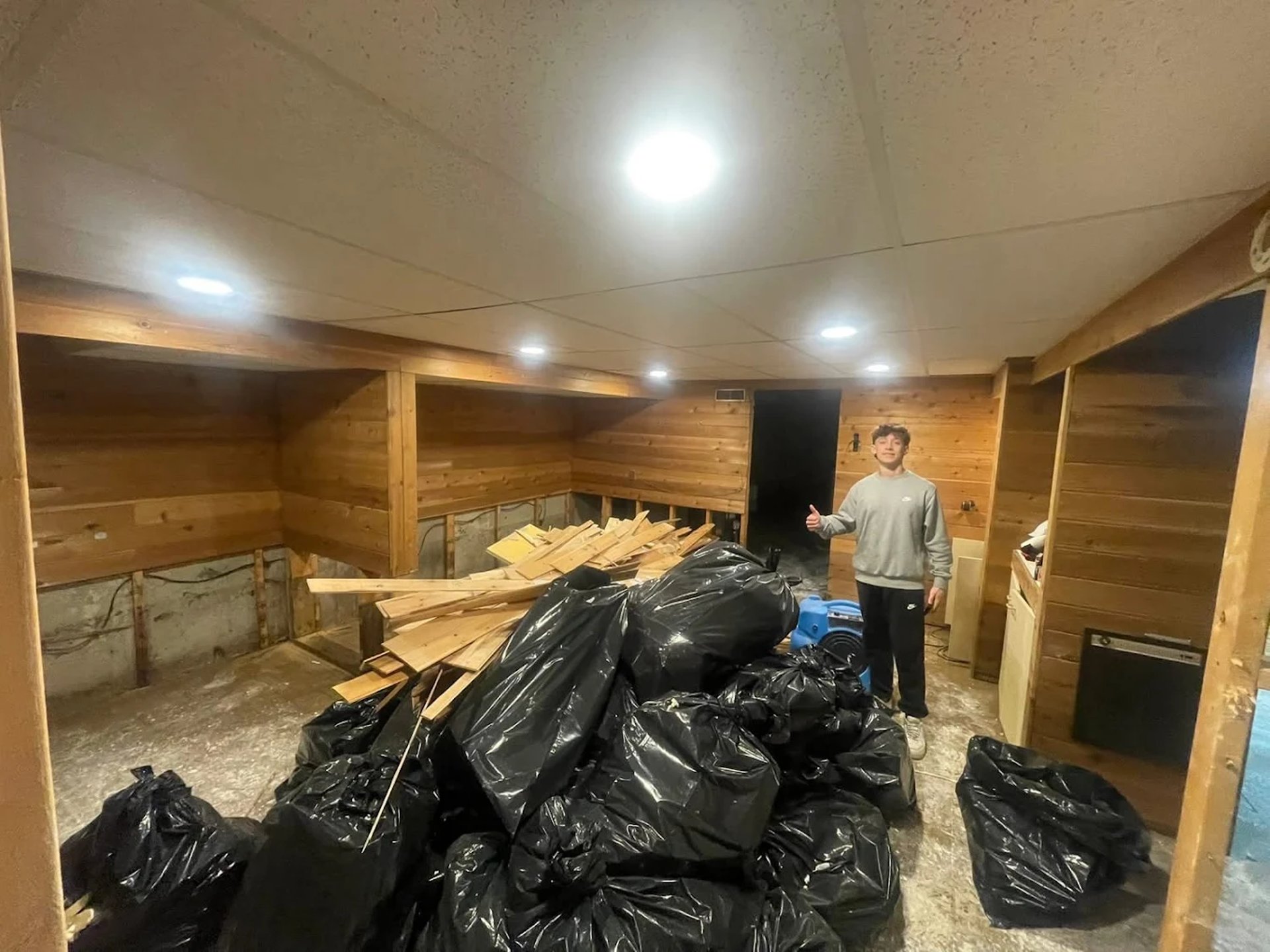 a couple of men working on a roof