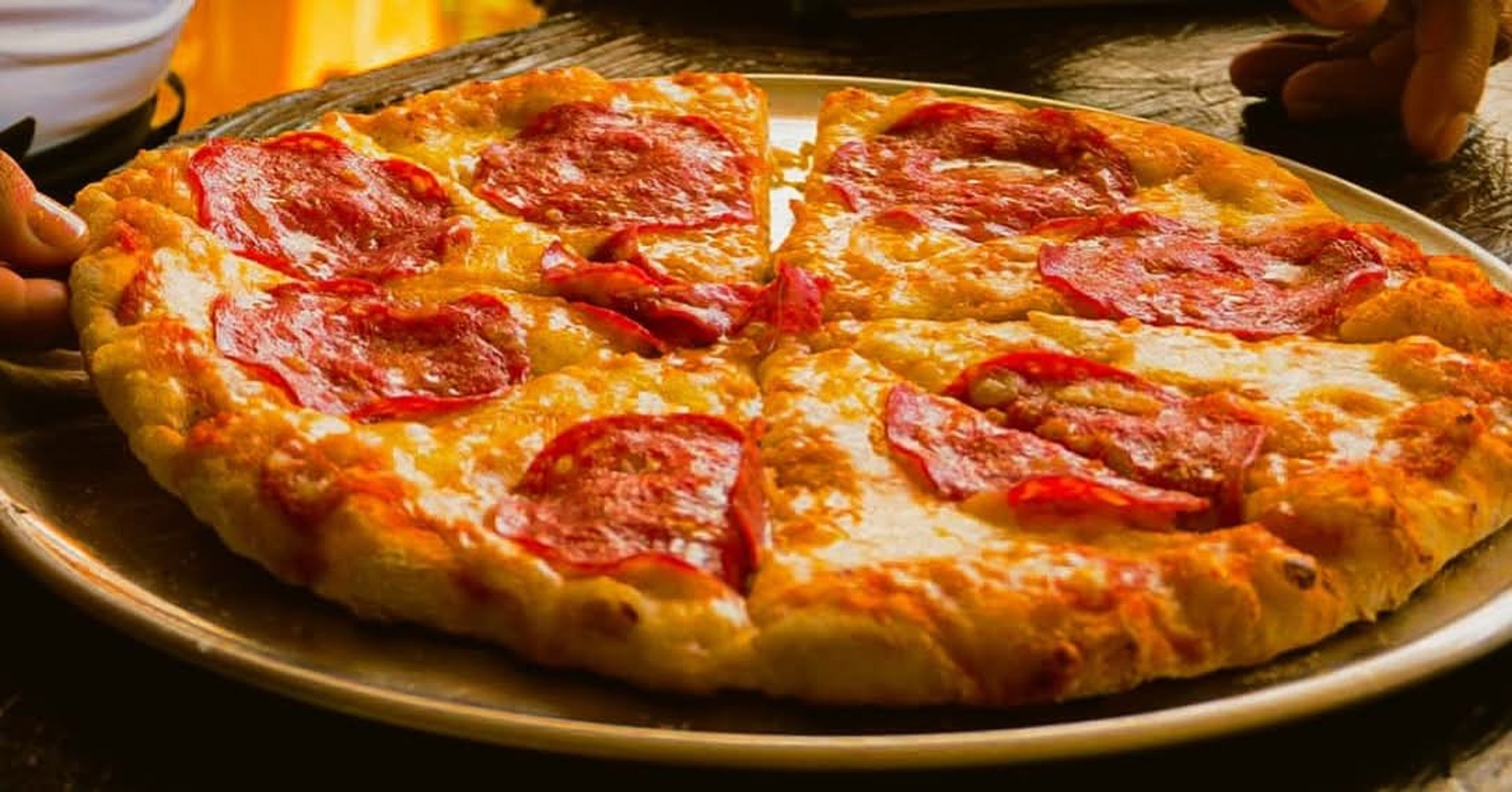 woman wearing yellow long-sleeved dress under white clouds and blue sky during daytime