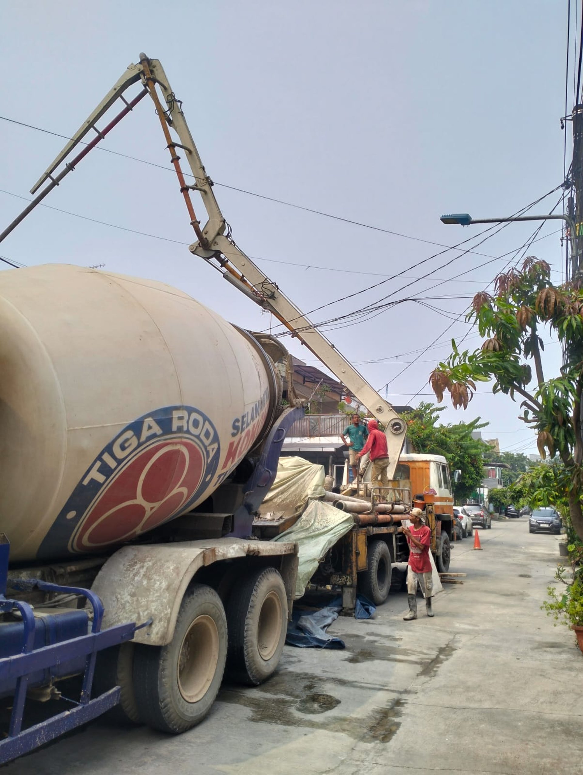 a cement truck parked on the side of the road