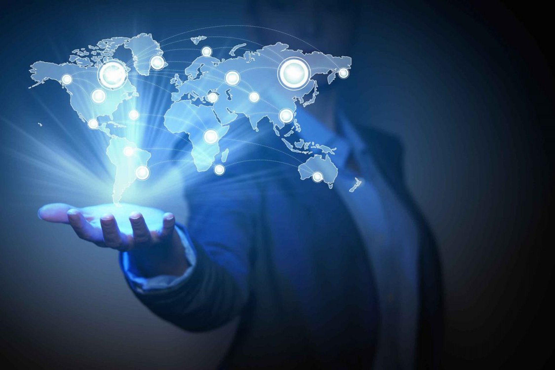 Four smiling business people taking a selfie together.