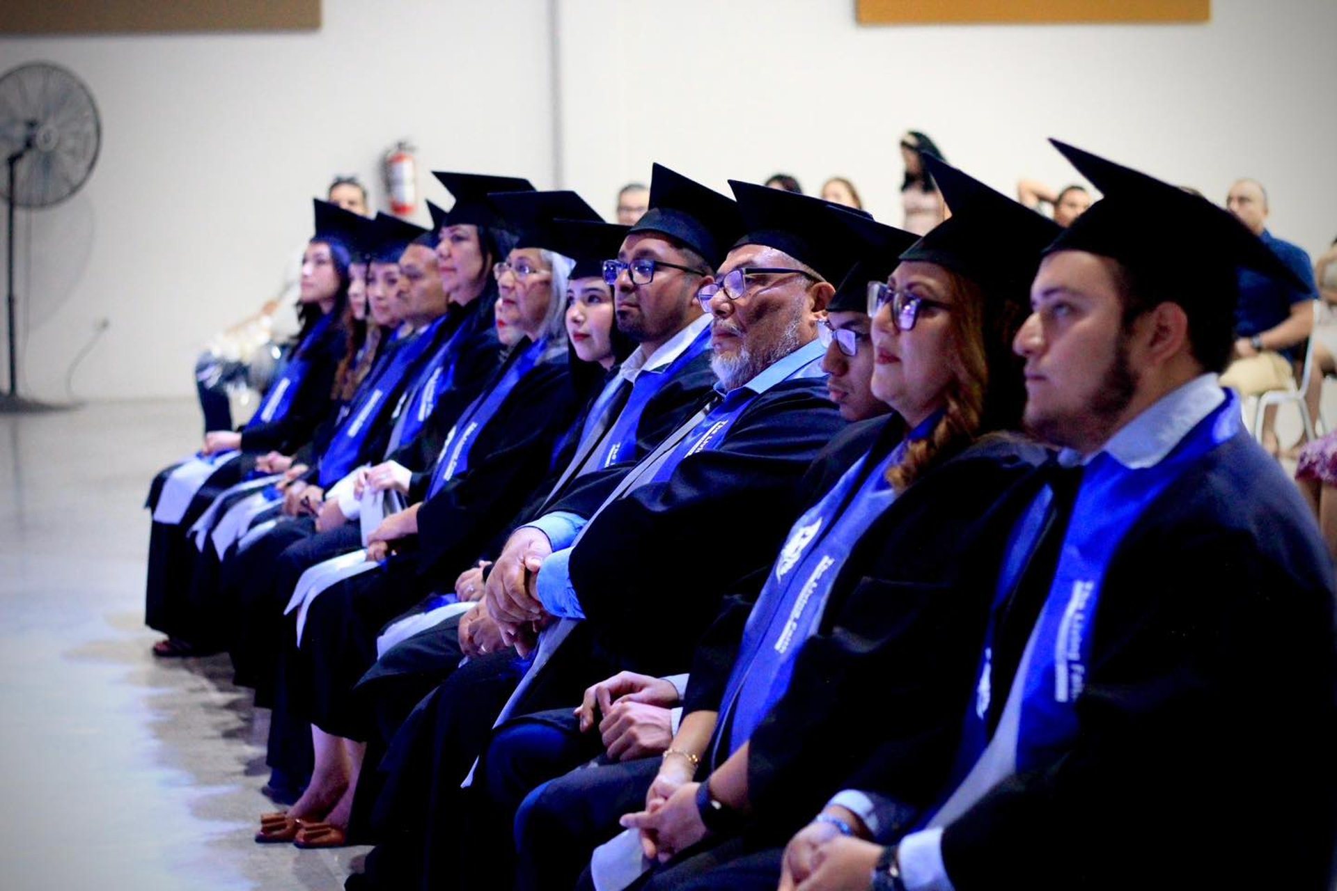 an abstract photo of a curved building with a blue sky in the background