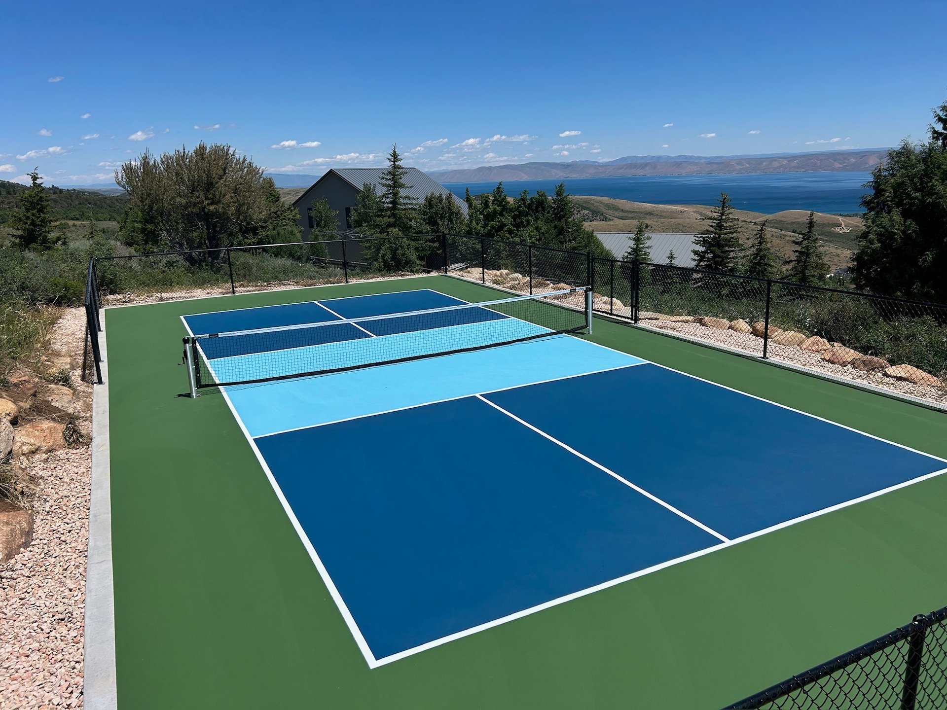 white and brown concrete building near green grass field during daytime