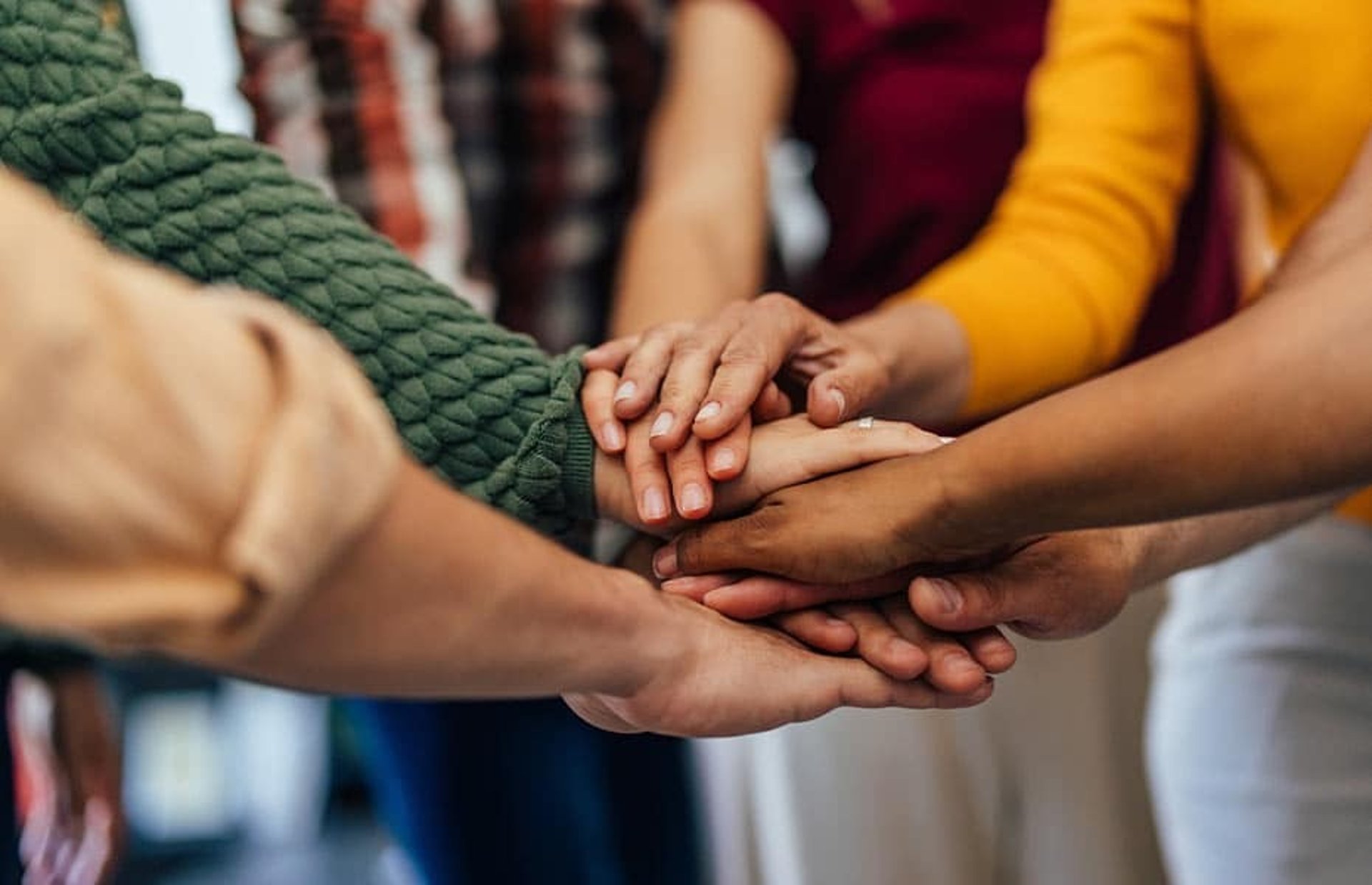 an abstract photo of a curved building with a blue sky in the background