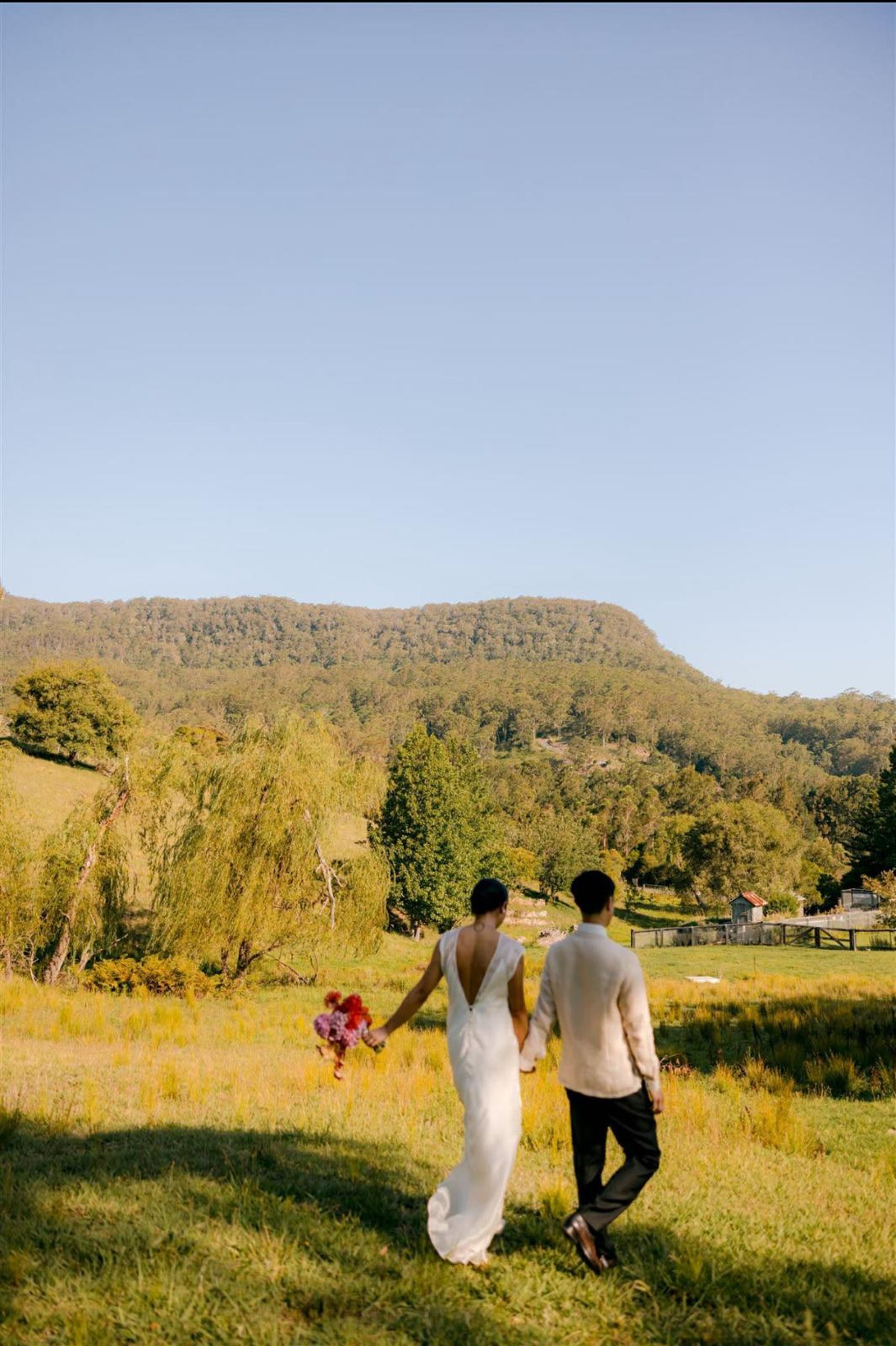 a man and woman kissing in a field