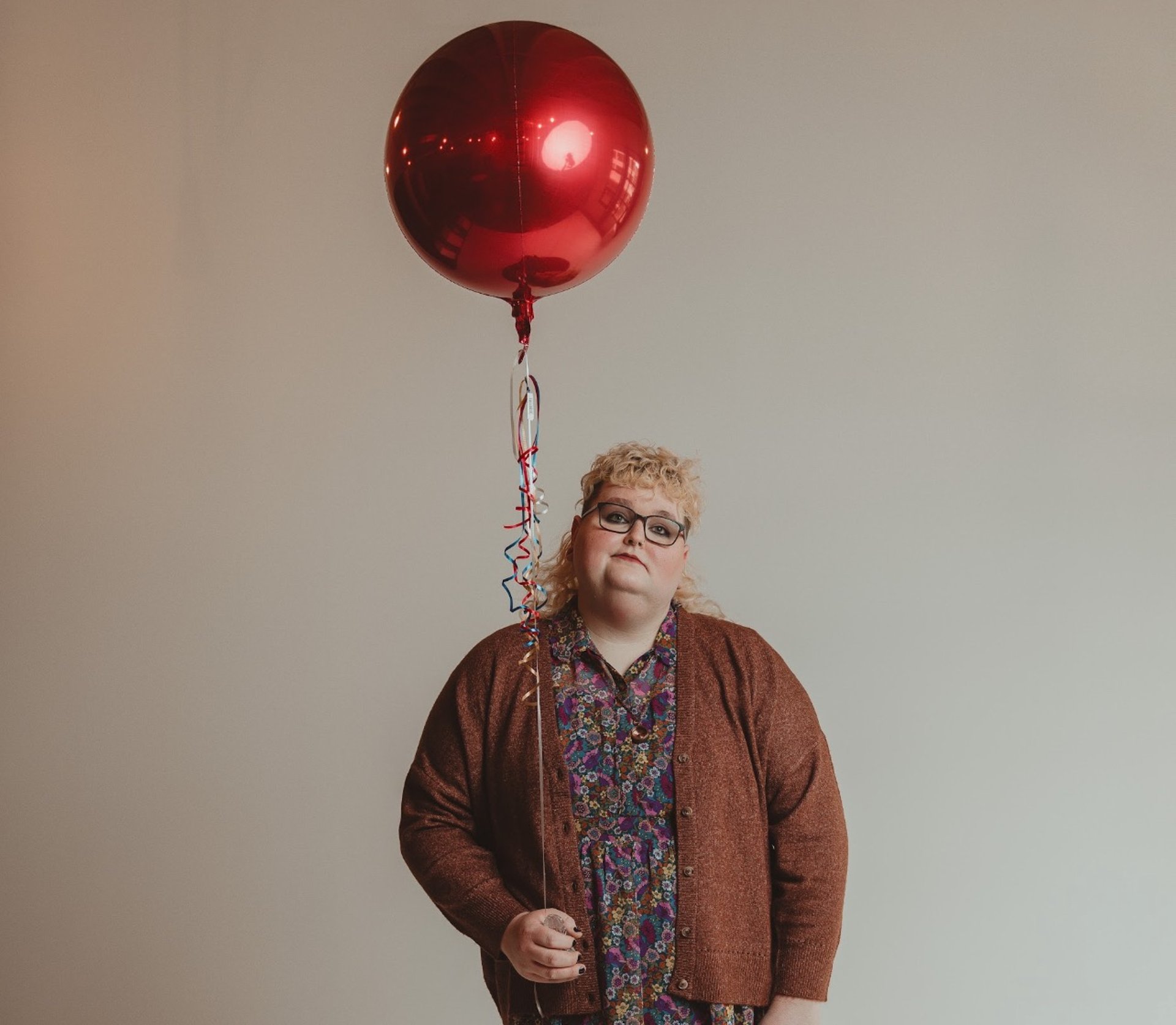woman wearing yellow long-sleeved dress under white clouds and blue sky during daytime