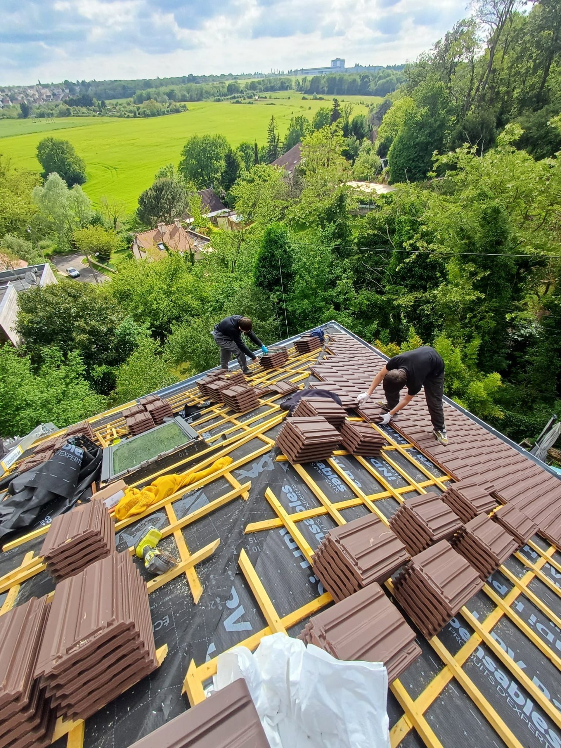 A man on a roof working on a roof