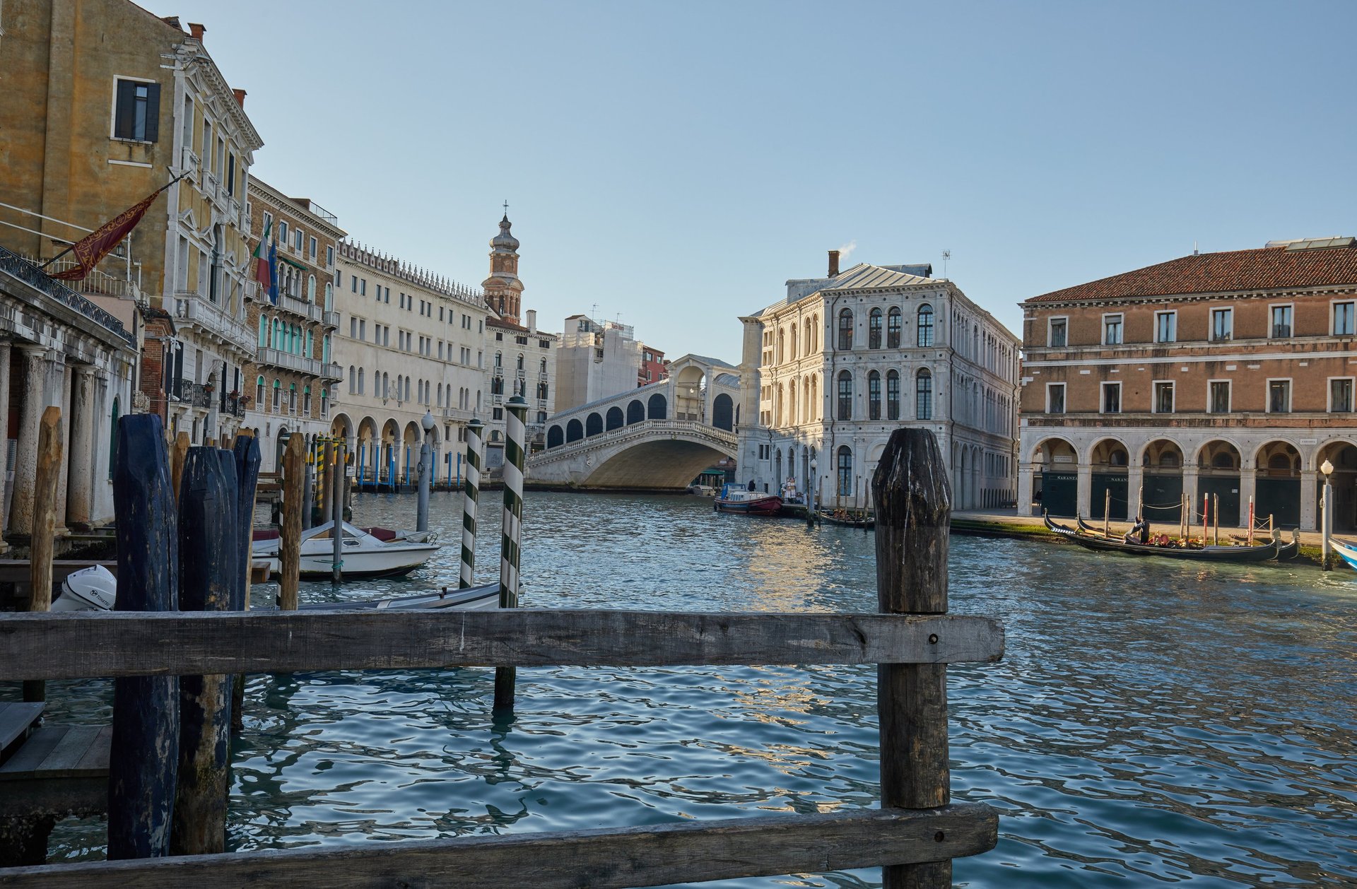 woman wearing yellow long-sleeved dress under white clouds and blue sky during daytime