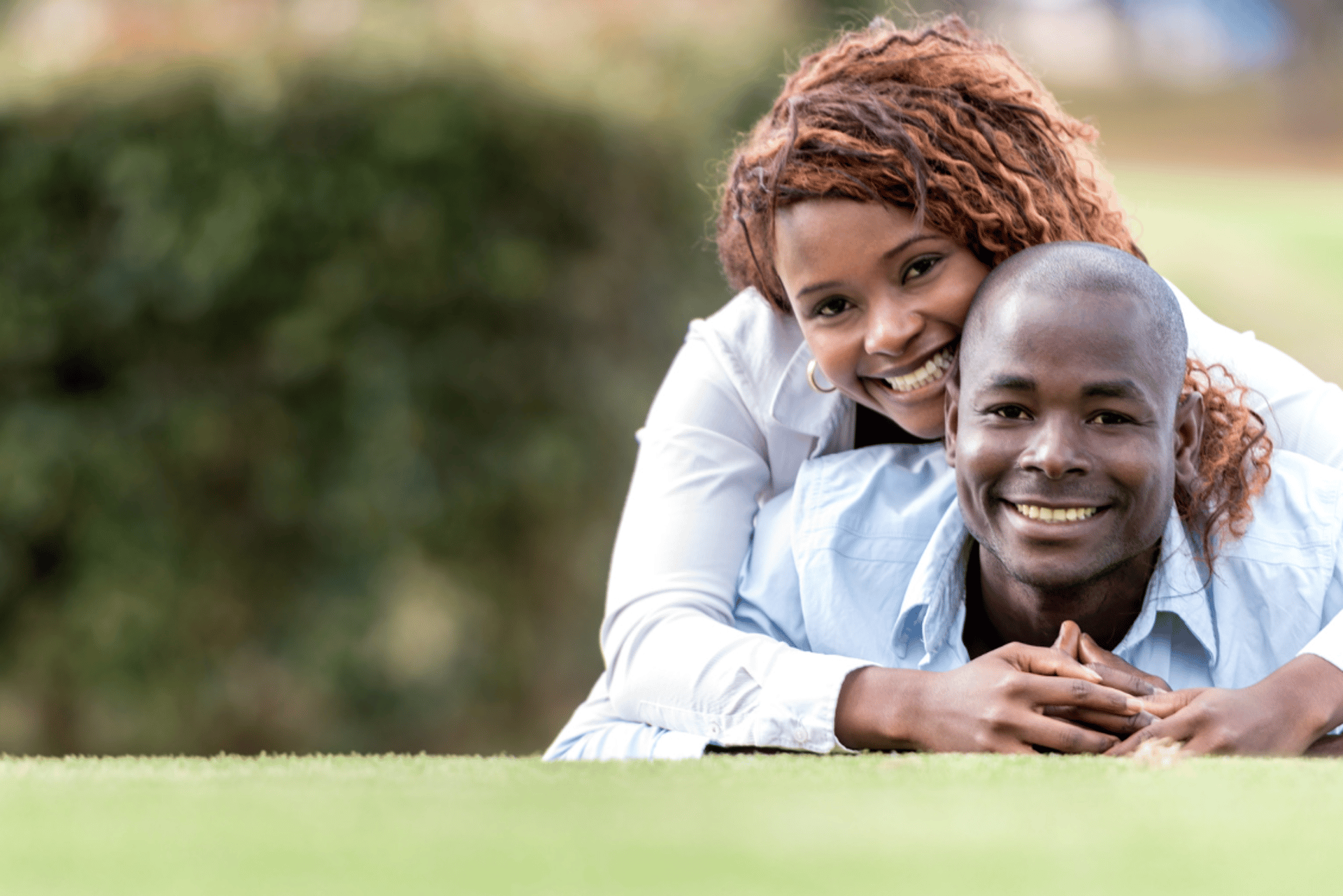selective focus photography of man and woman near trees