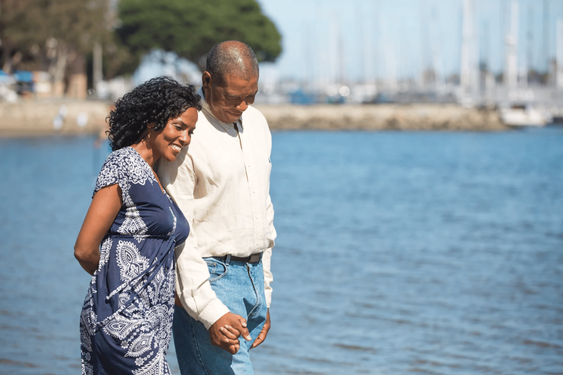 a man and a woman standing in a field