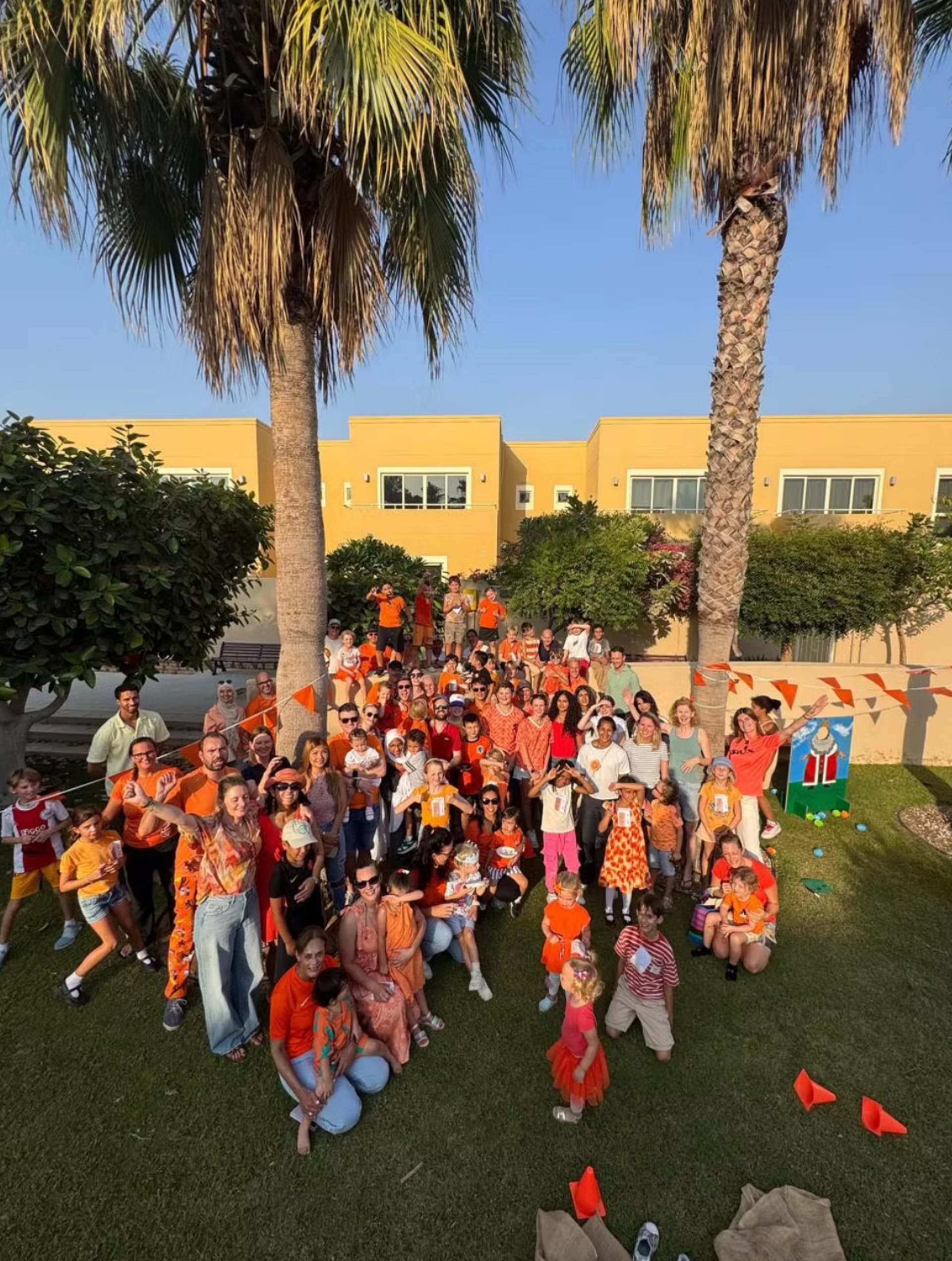 woman wearing yellow long-sleeved dress under white clouds and blue sky during daytime