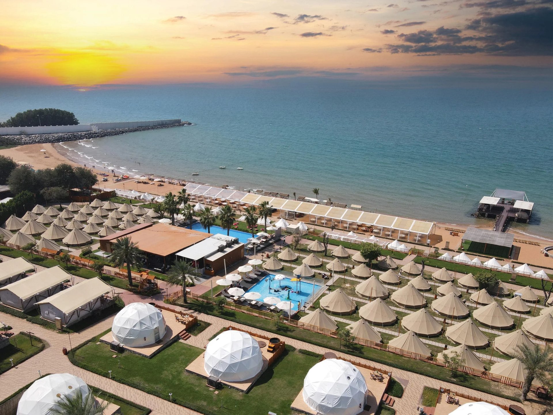 an abstract photo of a curved building with a blue sky in the background