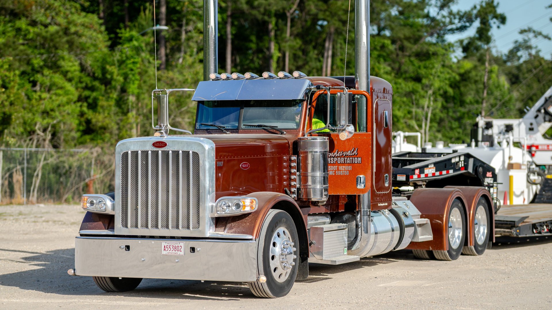 aerial photography of three heavy equipment