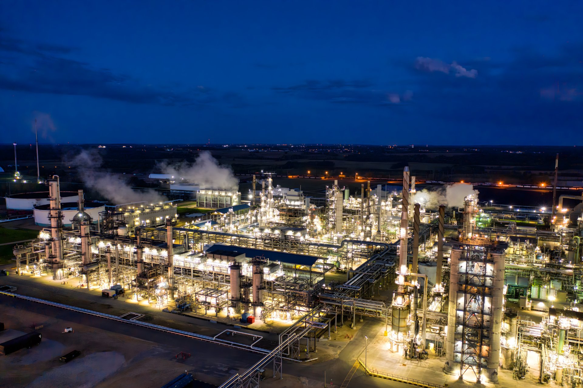 aerial photography of three heavy equipment