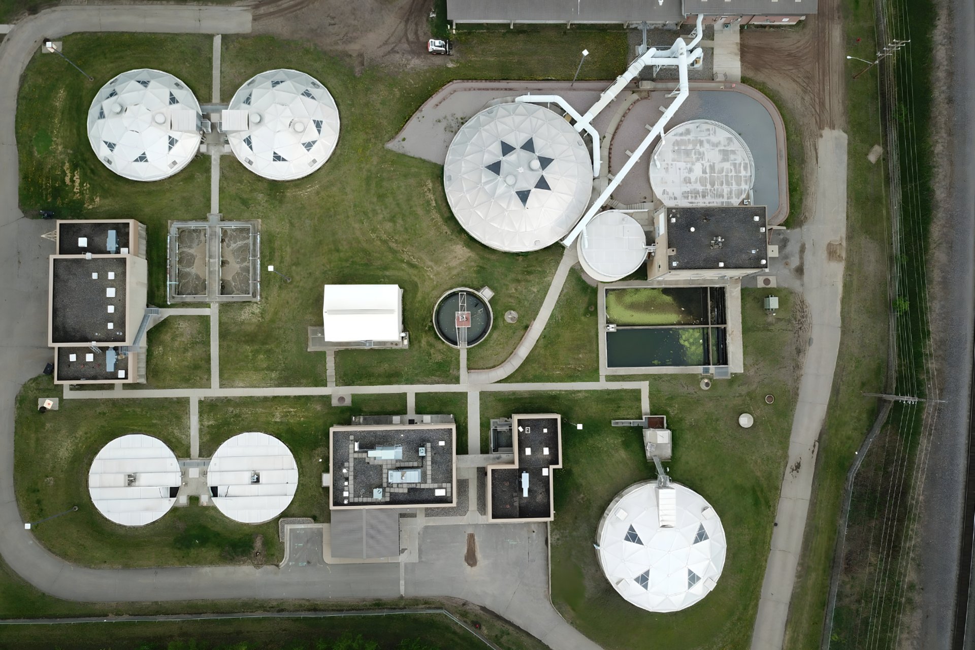 aerial photography of three heavy equipment