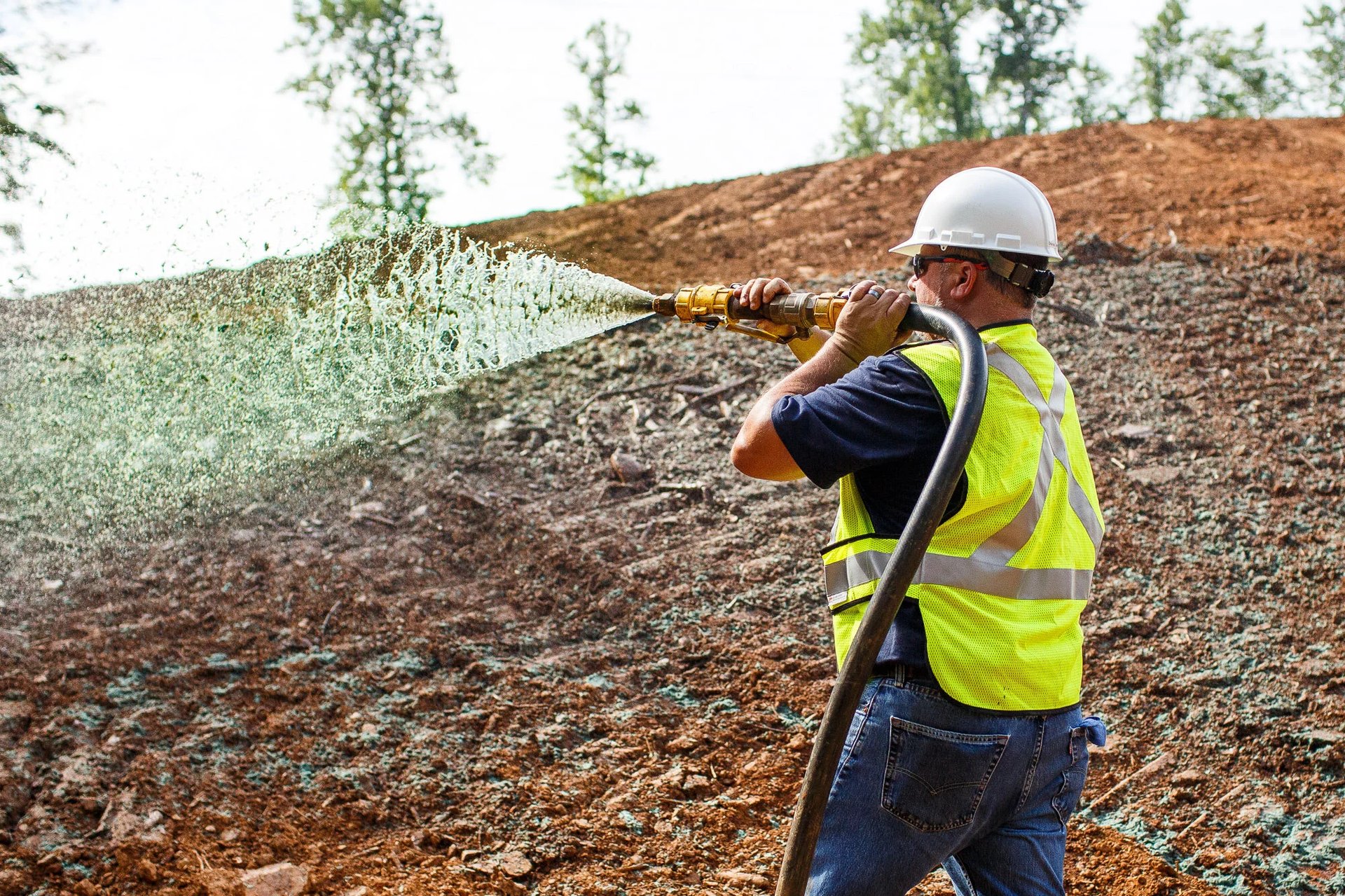 aerial photography of three heavy equipment