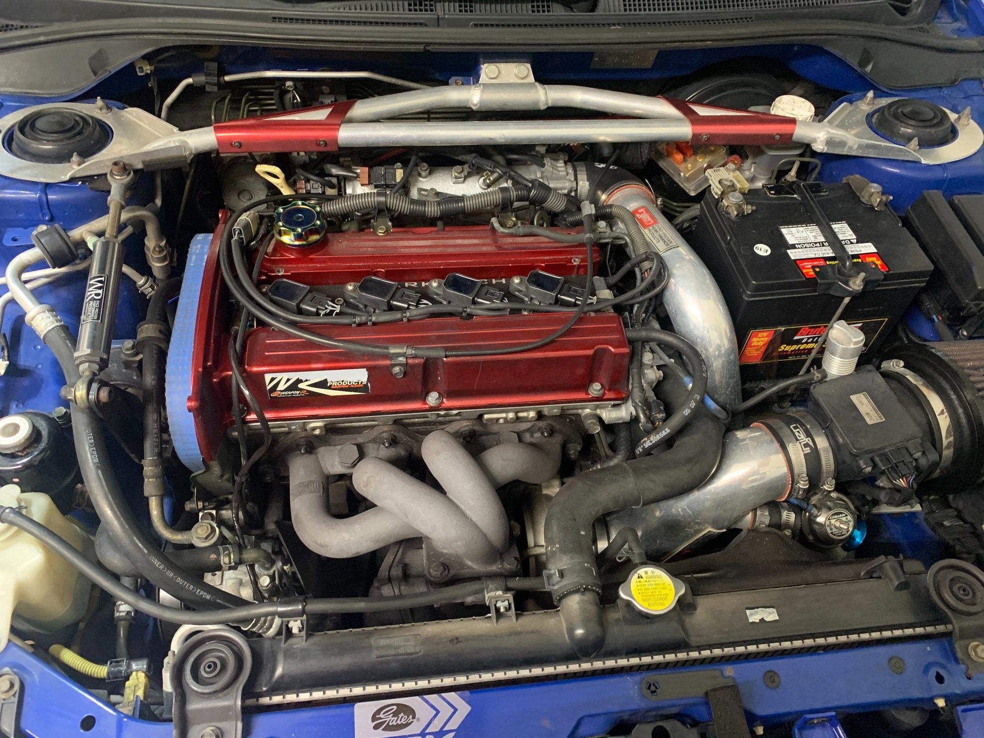 Detailed view of a modified blue car engine