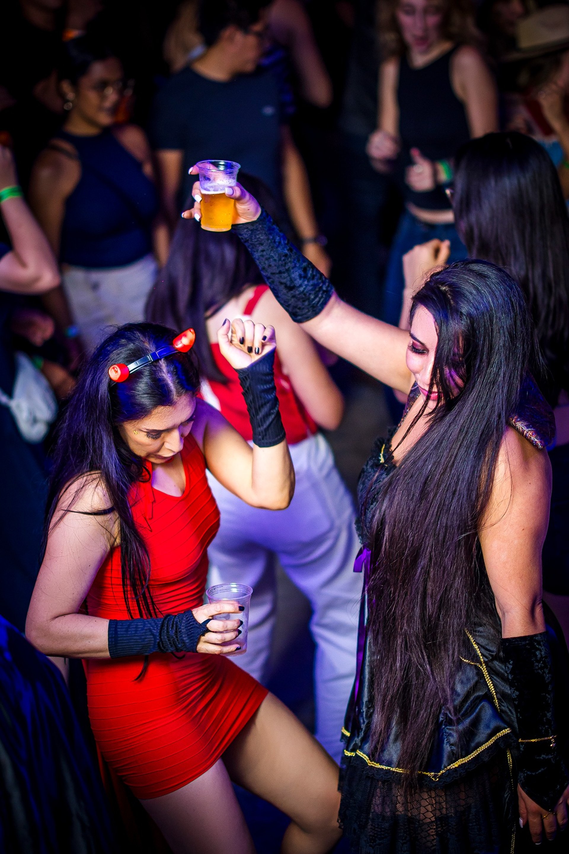 woman wearing yellow long-sleeved dress under white clouds and blue sky during daytime