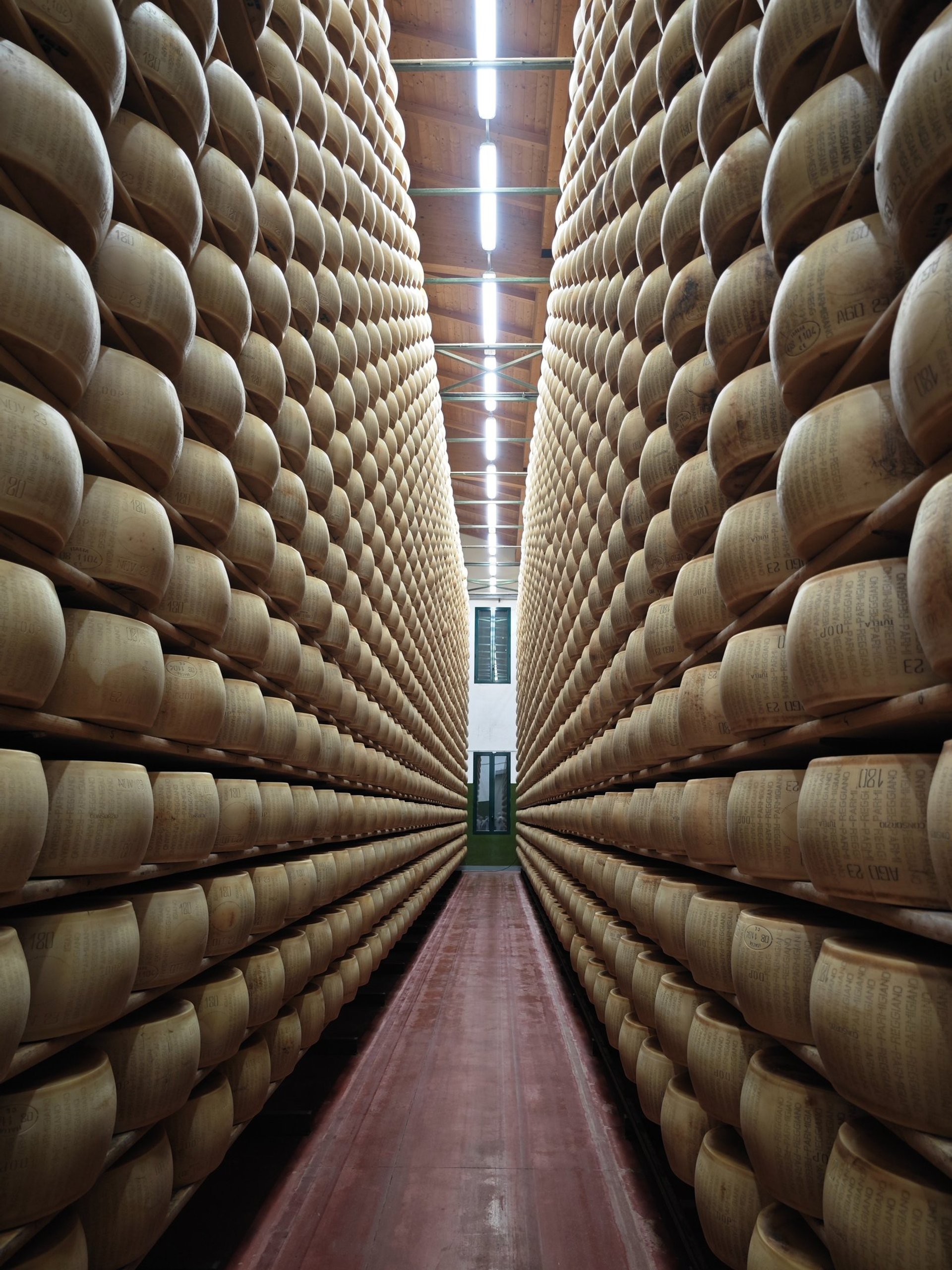 an abstract photo of a curved building with a blue sky in the background