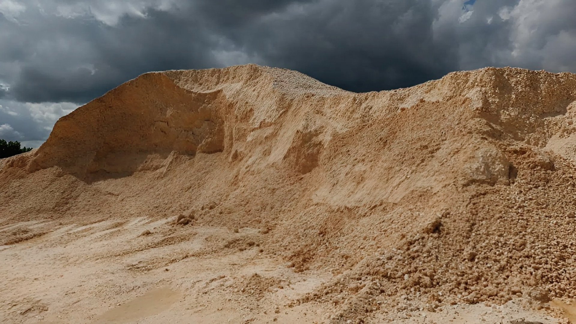 yellow and black heavy equipment on brown field during daytime