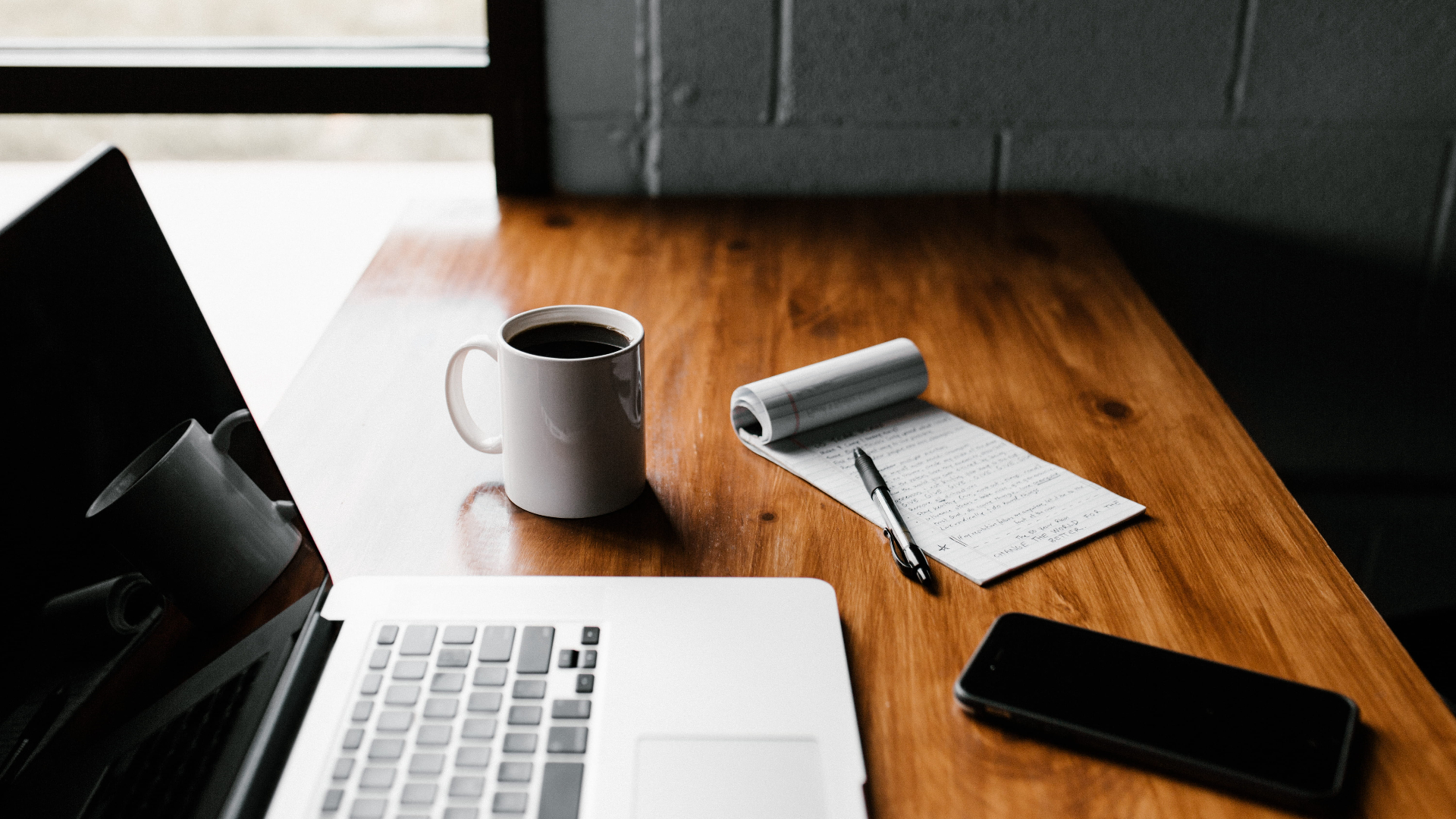 an abstract photo of a curved building with a blue sky in the background