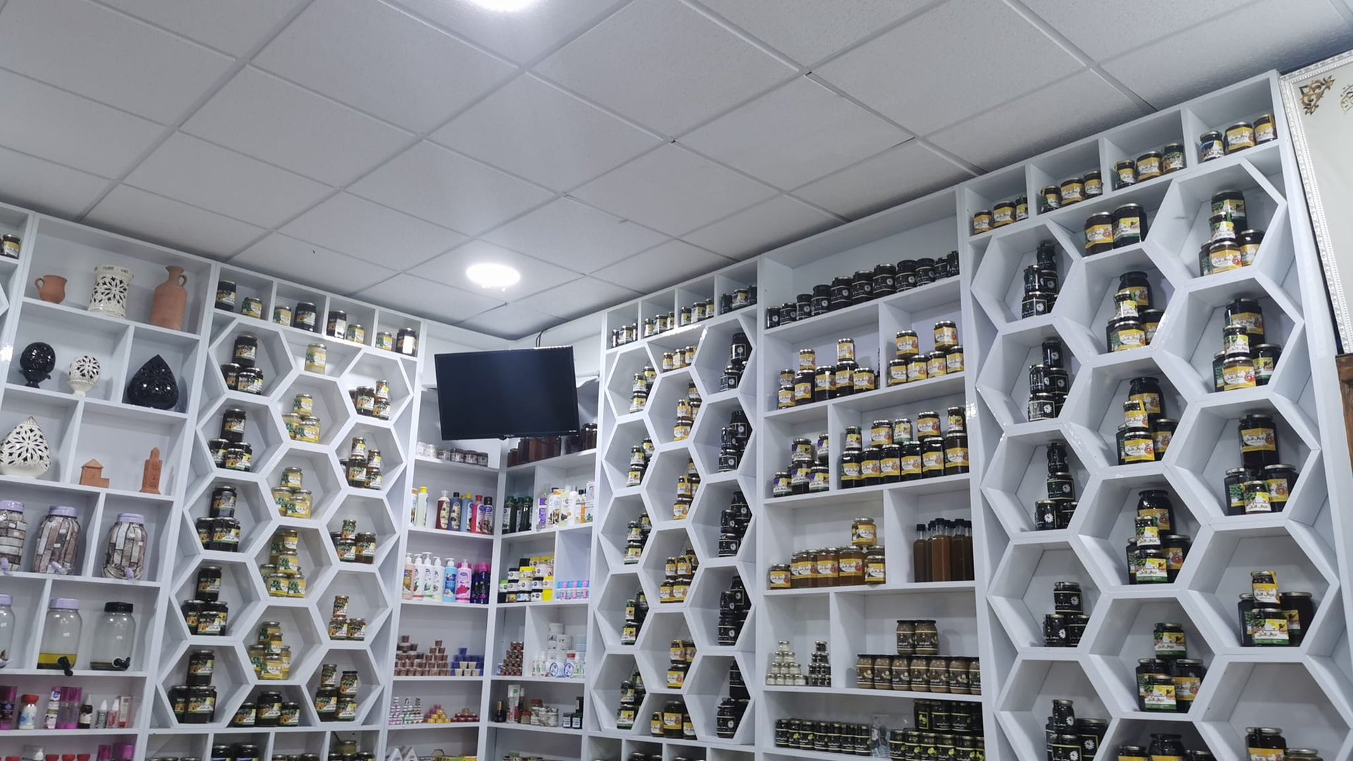 an abstract photo of a curved building with a blue sky in the background