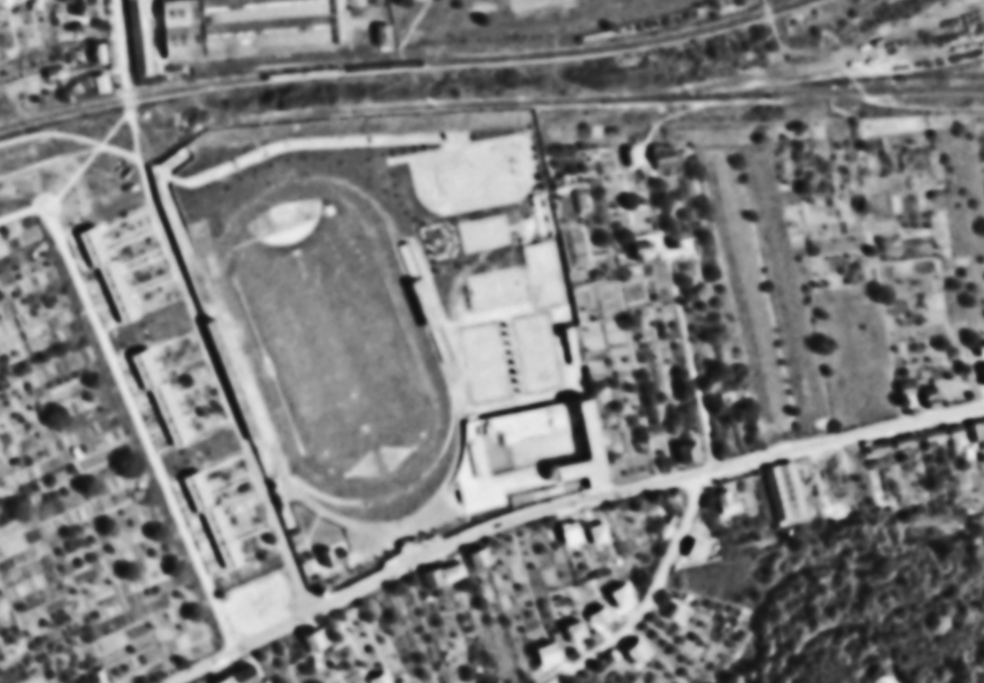 an abstract photo of a curved building with a blue sky in the background