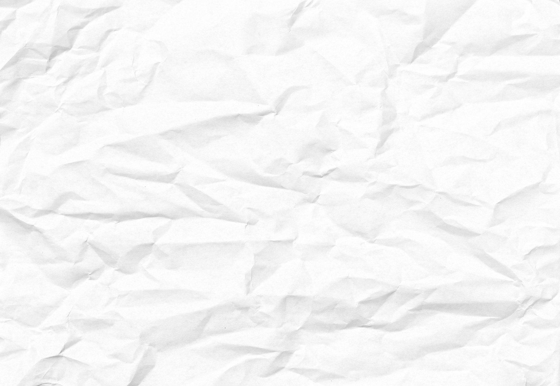 white textile on brown wooden table